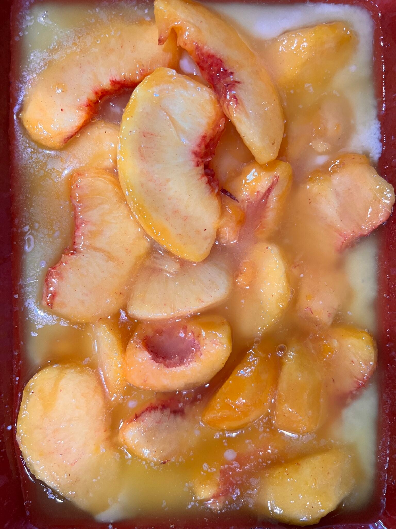 peach cobbler ingredients in pan