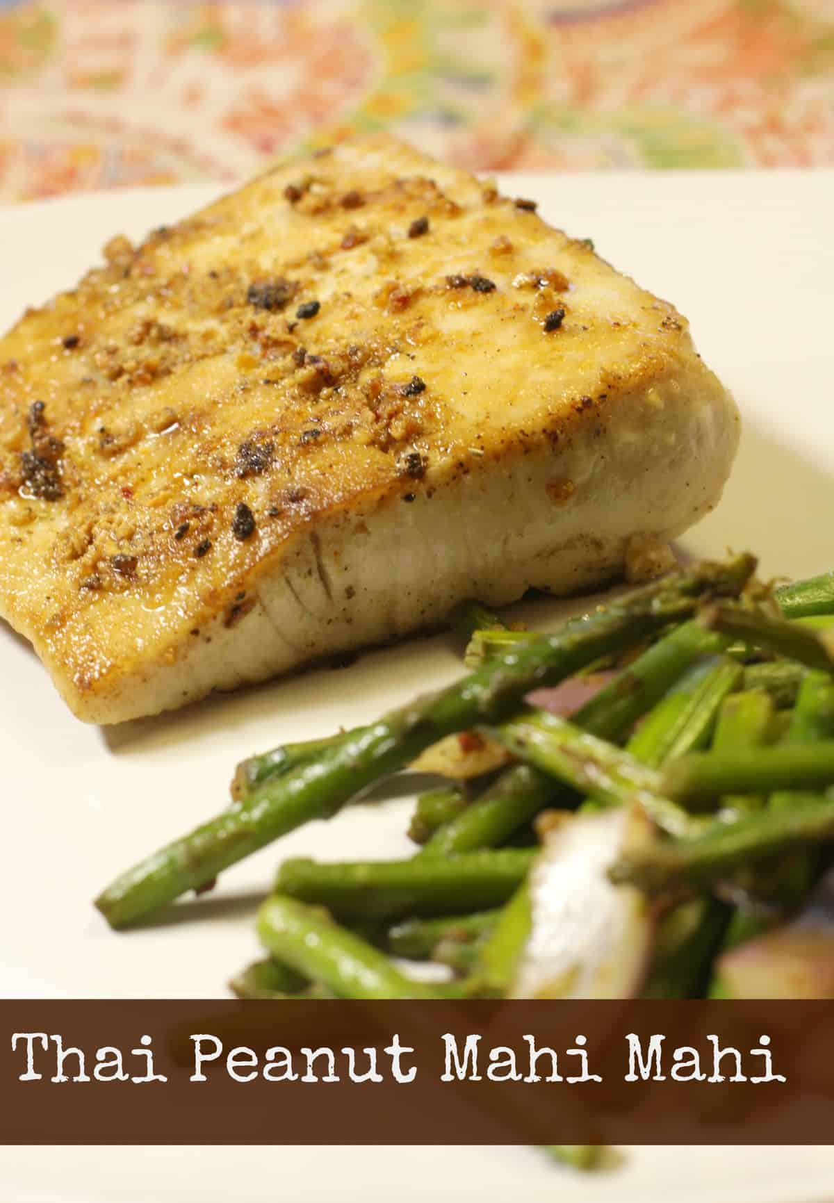 A plate of thai peanut salmon served with green beans.