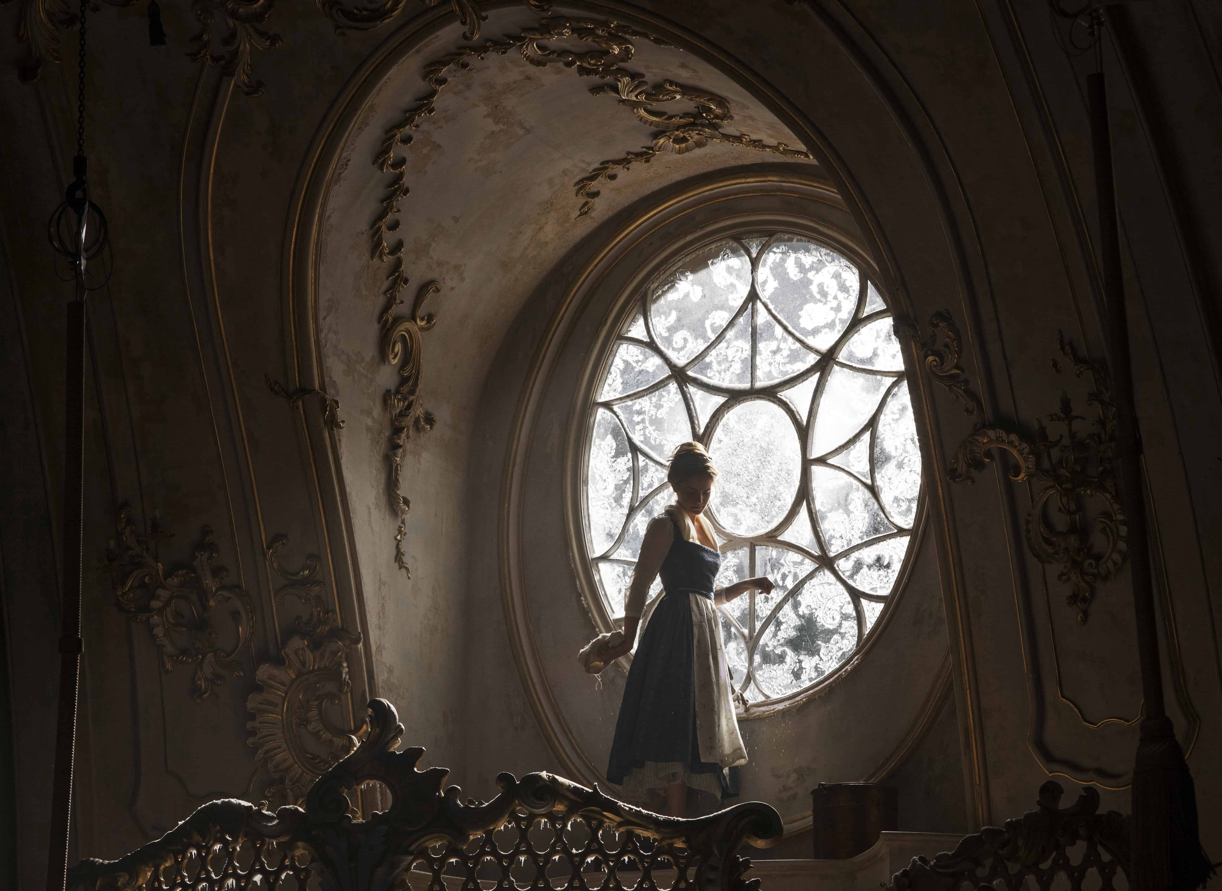 A large clock hanging from the ceiling