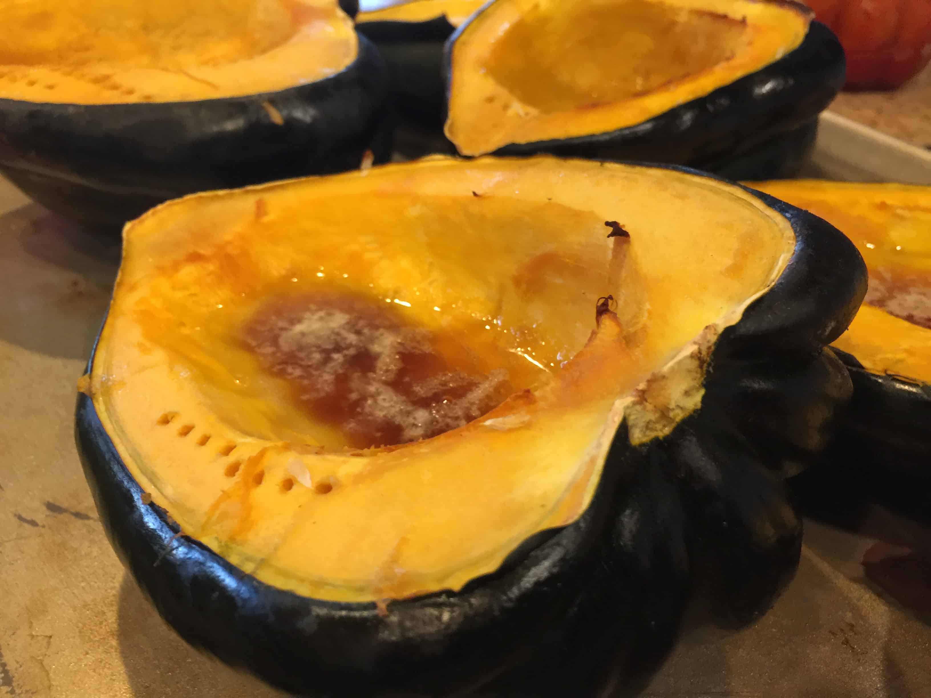 Cook acorn squash, cut in half.