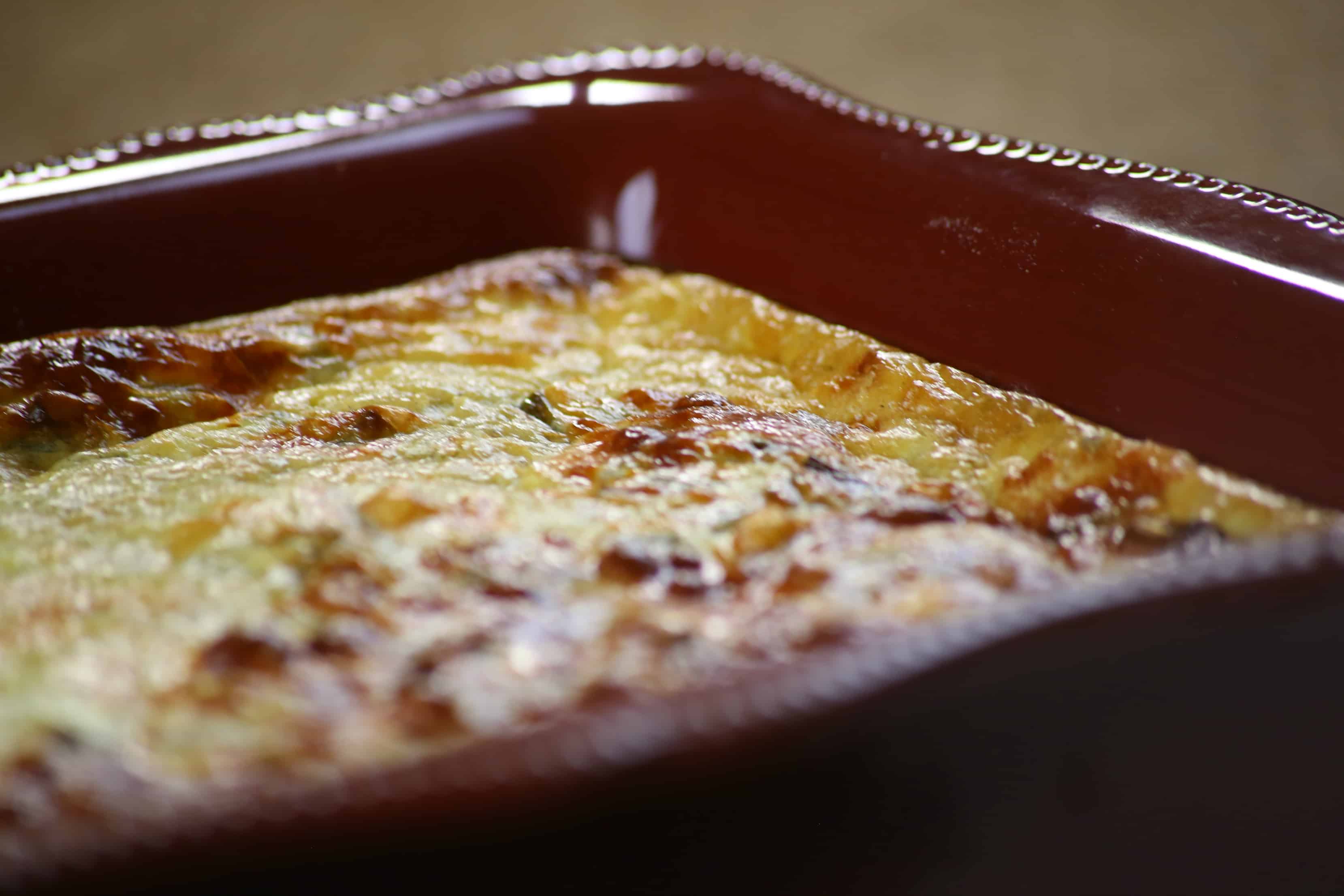 Easy Ham and Cheese Breakfast Quiche A close up of a slice of pizza