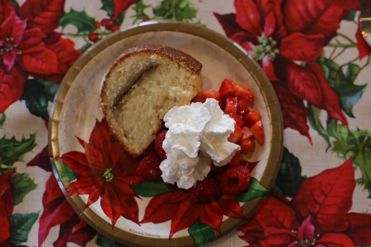 A plate of food on a table, with Whipped cream