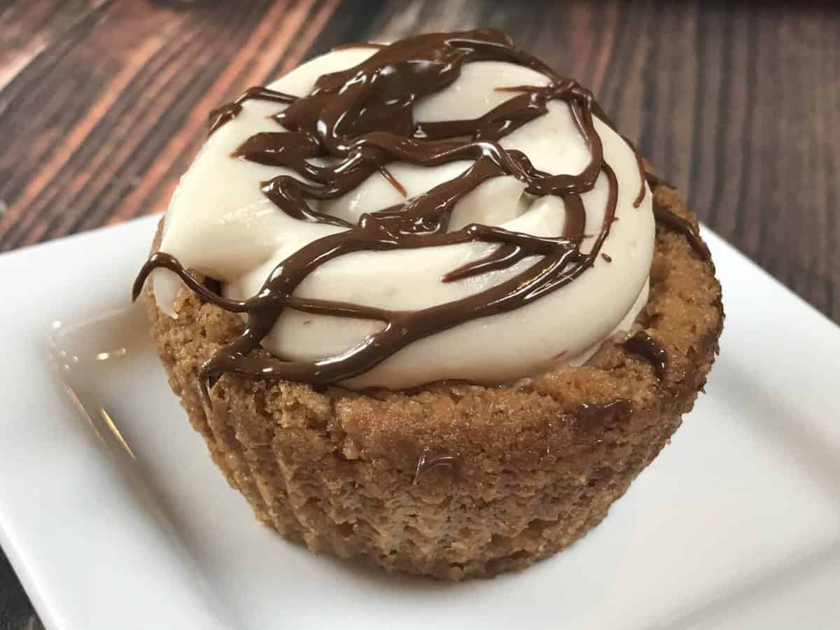 Peanut Butter Cream Cheese Cookie Cups A close up of a piece of chocolate cake on a plate, with Cookie and Cheesecake