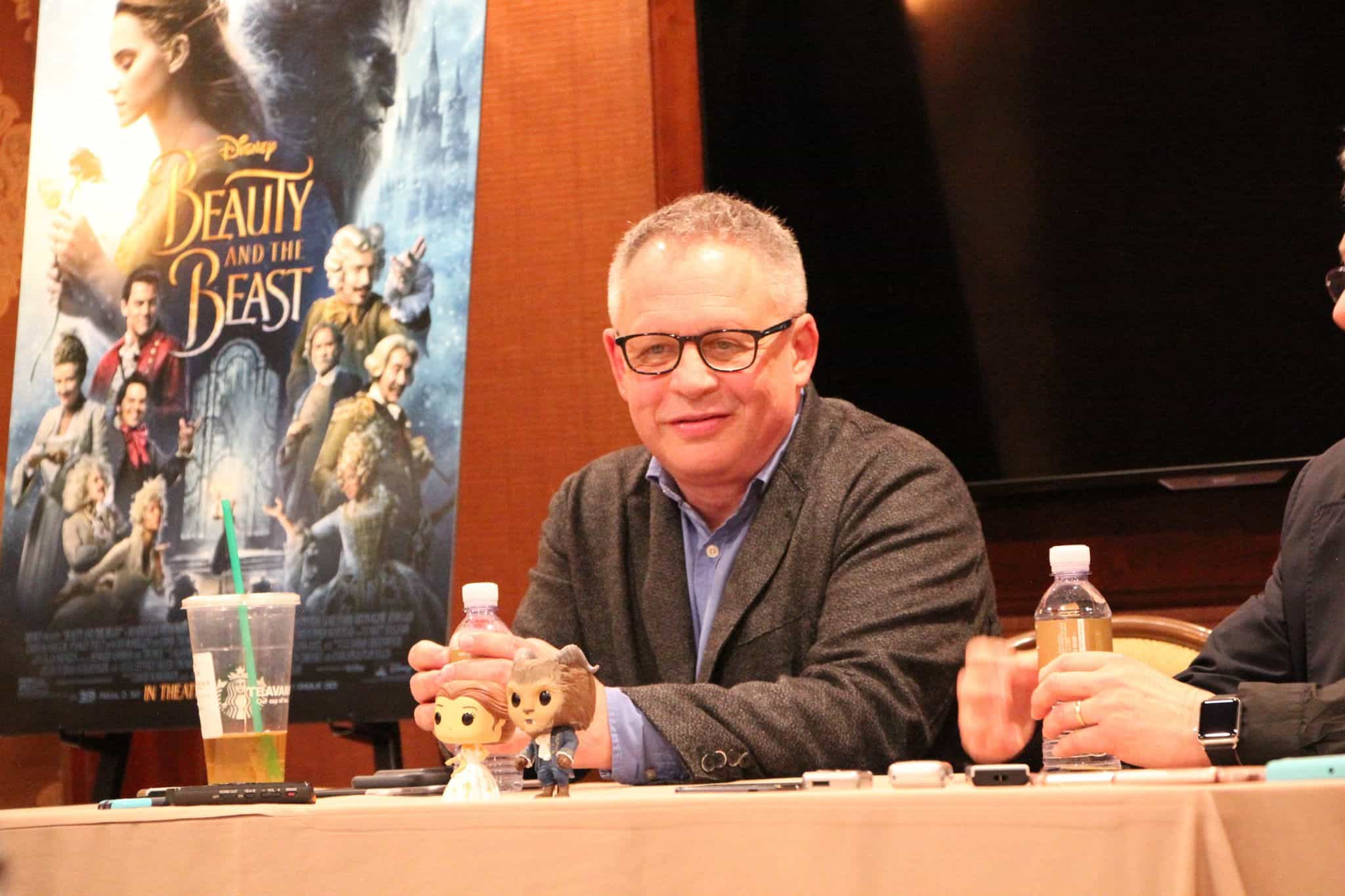 Bill Condon et al. sitting at a table