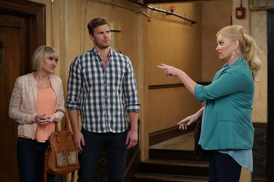 Derek Theler et al. that are standing in a room