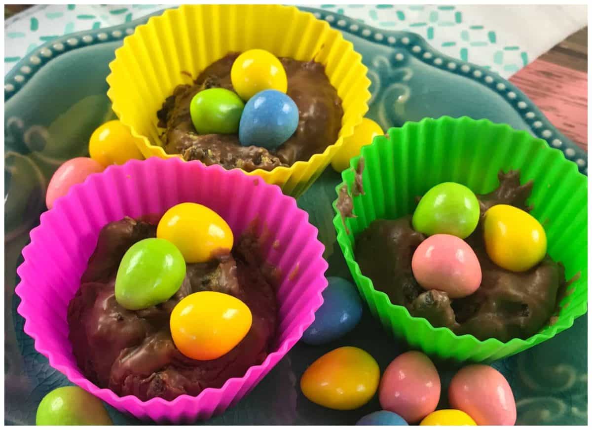 A plastic container filled with food, with Fudge and Oreo