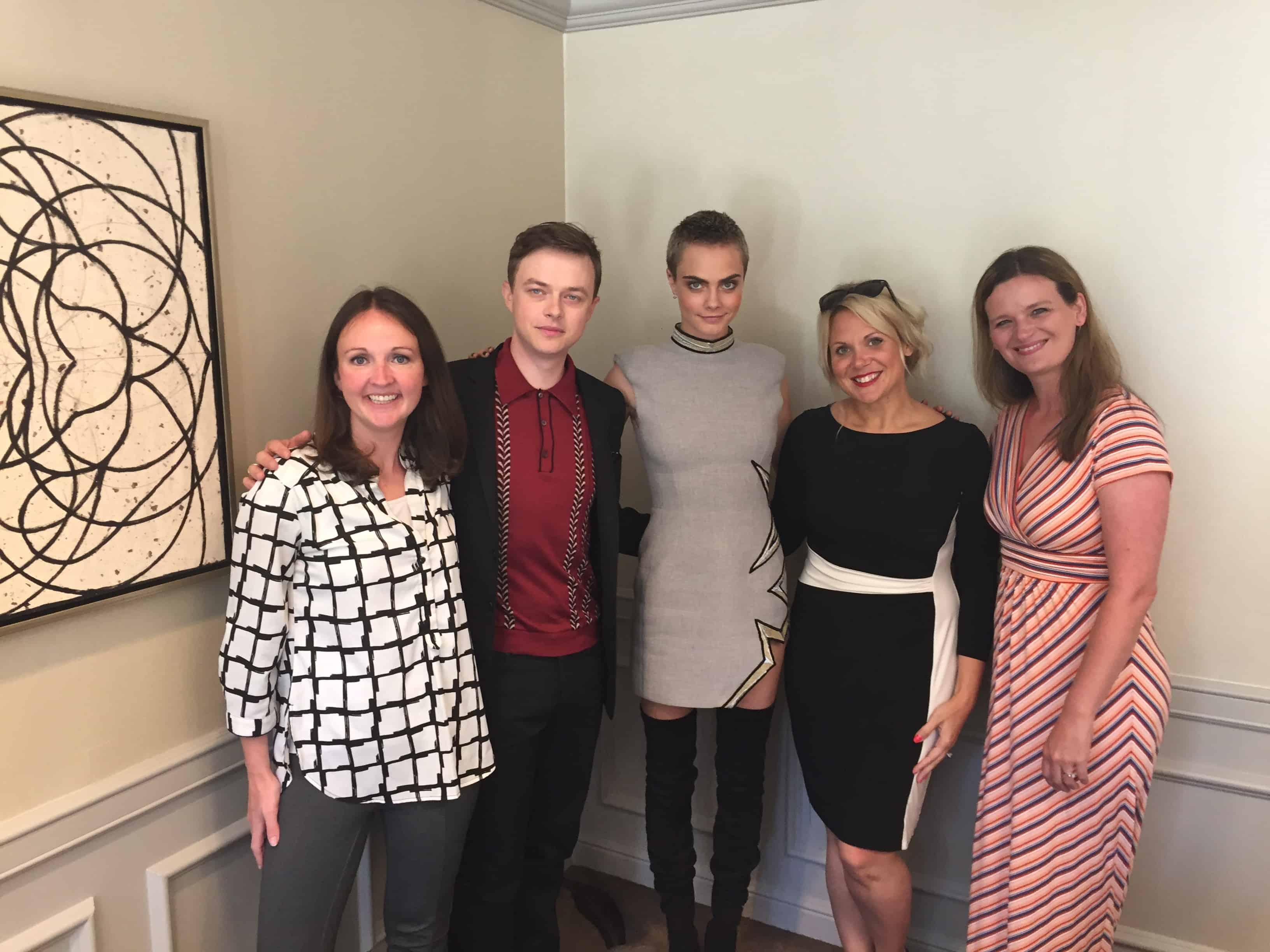 Dane DeHaan, Cara Delevingne posing for a photo