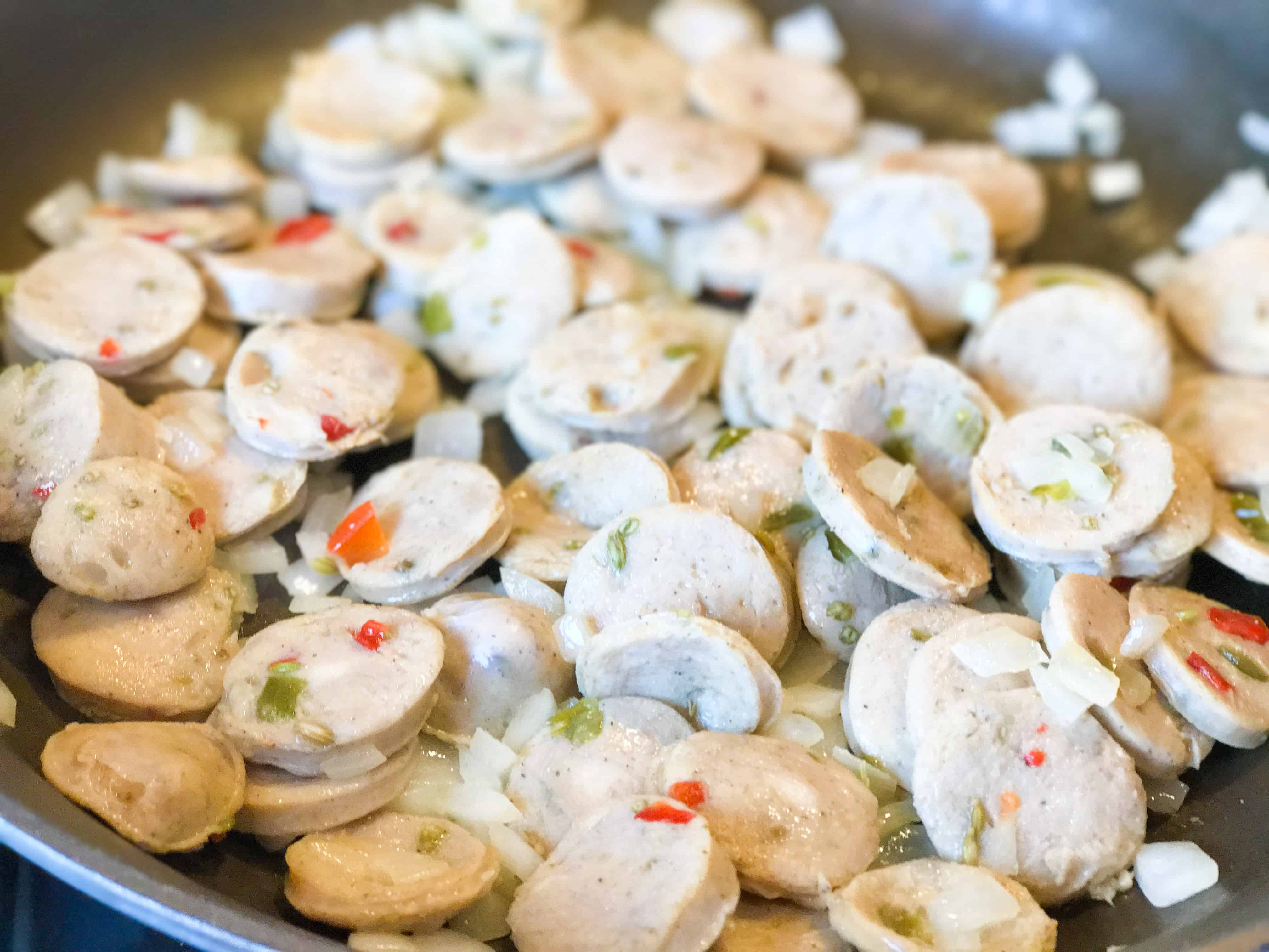 A close up of food, with Chicken and Sausage