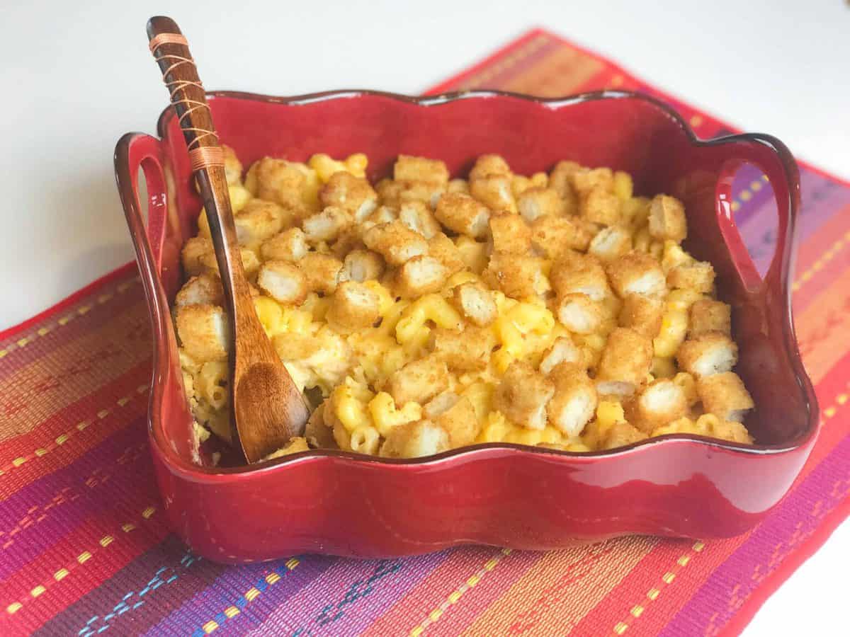 A basket full of food, with Cheese and Crock