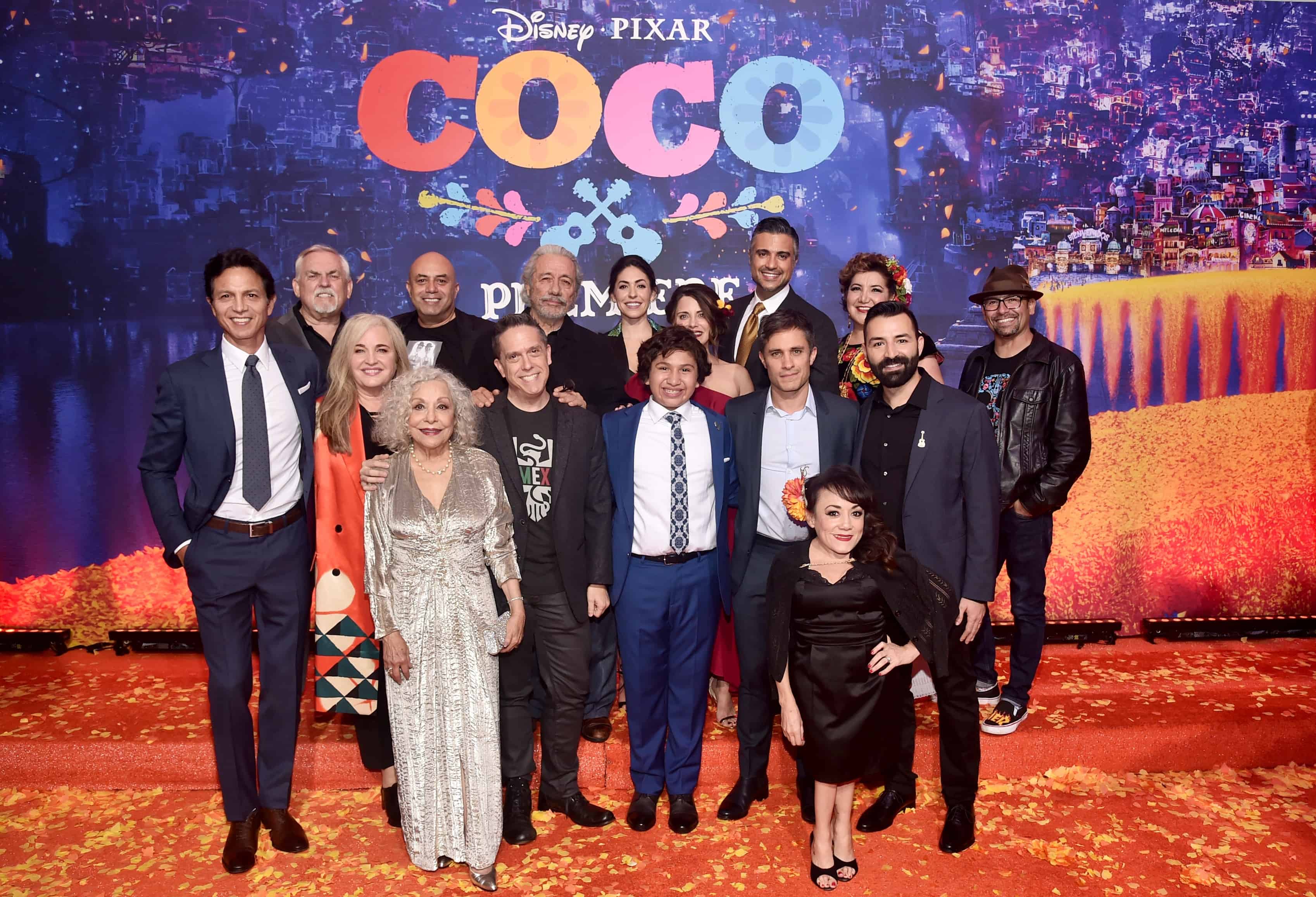 Benjamin Bratt, Lee Unkrich standing in front of a crowd posing for the camera