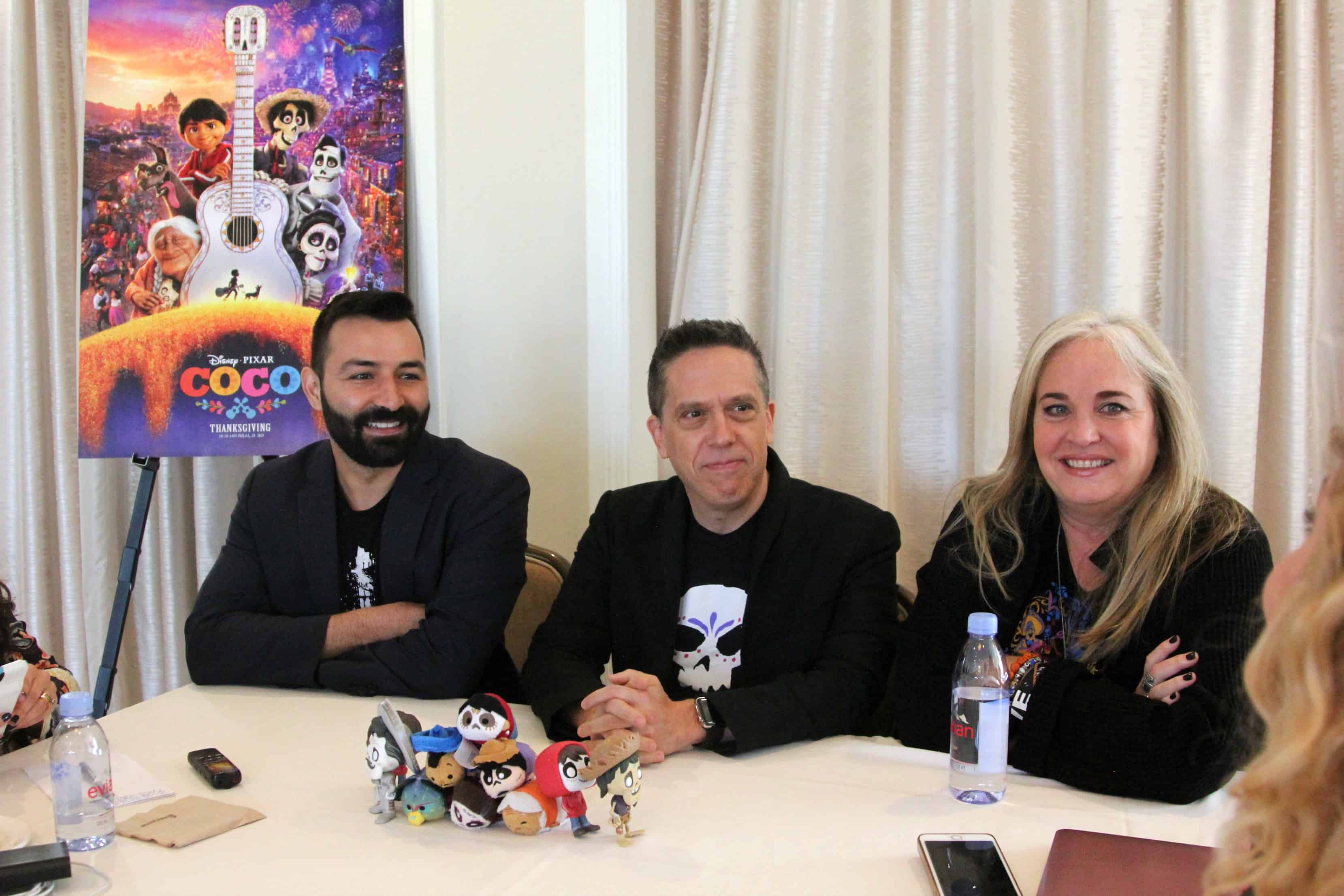Lee Unkrich, Darla K. Anderson sitting at a table in front of a curtain