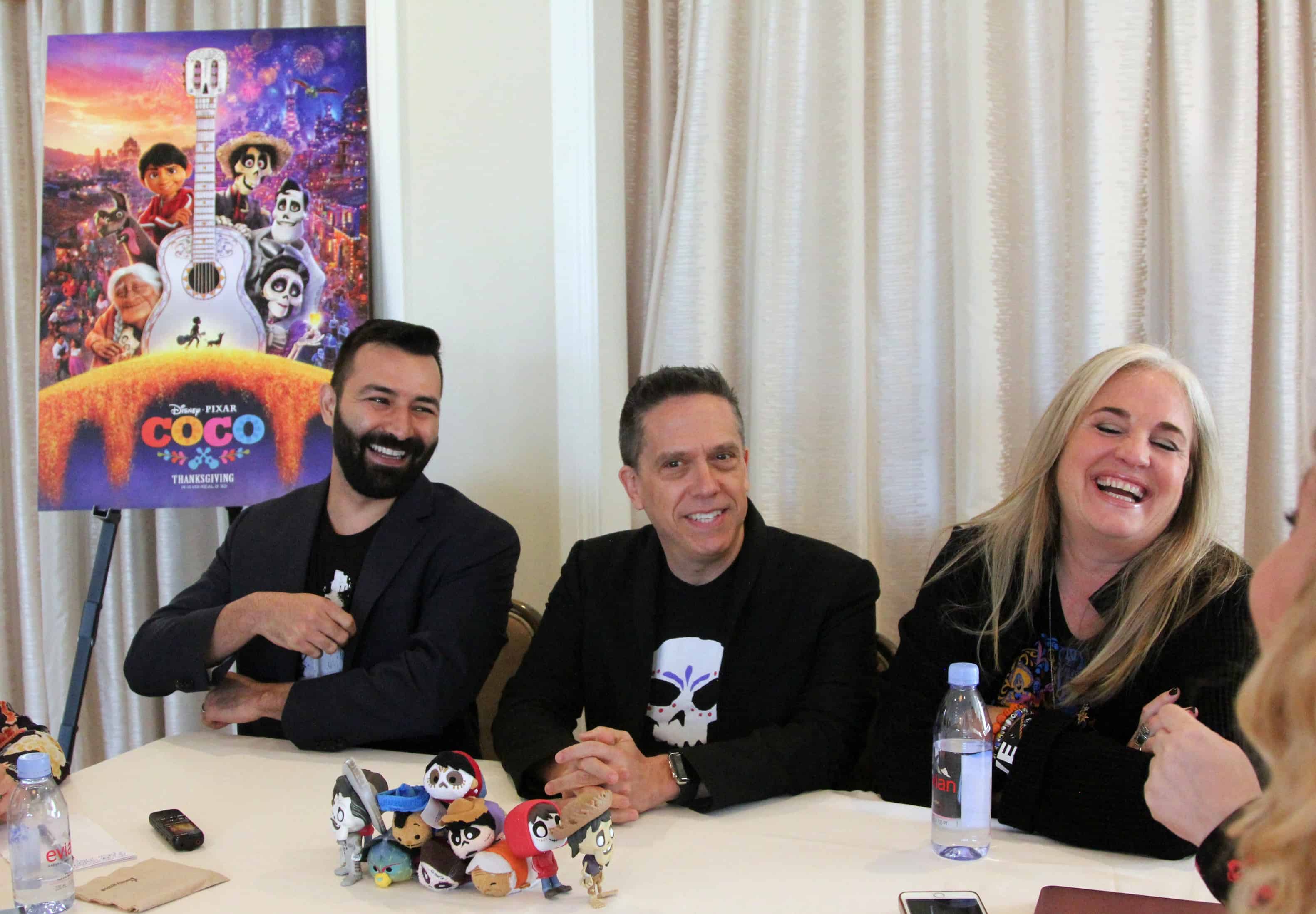 Lee Unkrich et al. sitting at a table posing for the camera