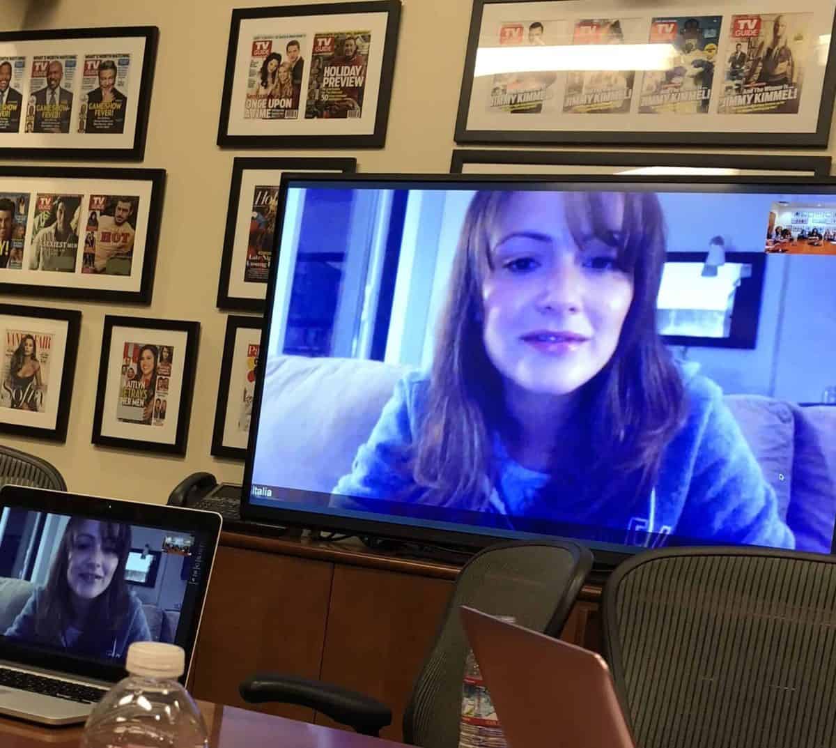 Italia Ricci sitting in front of a computer screen