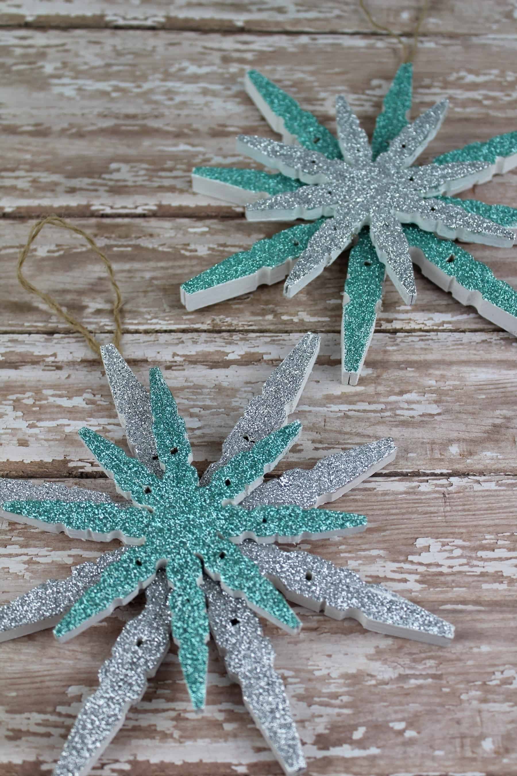 This Clothespin Glitter Snowflake Ornaments is a fun holiday craft for