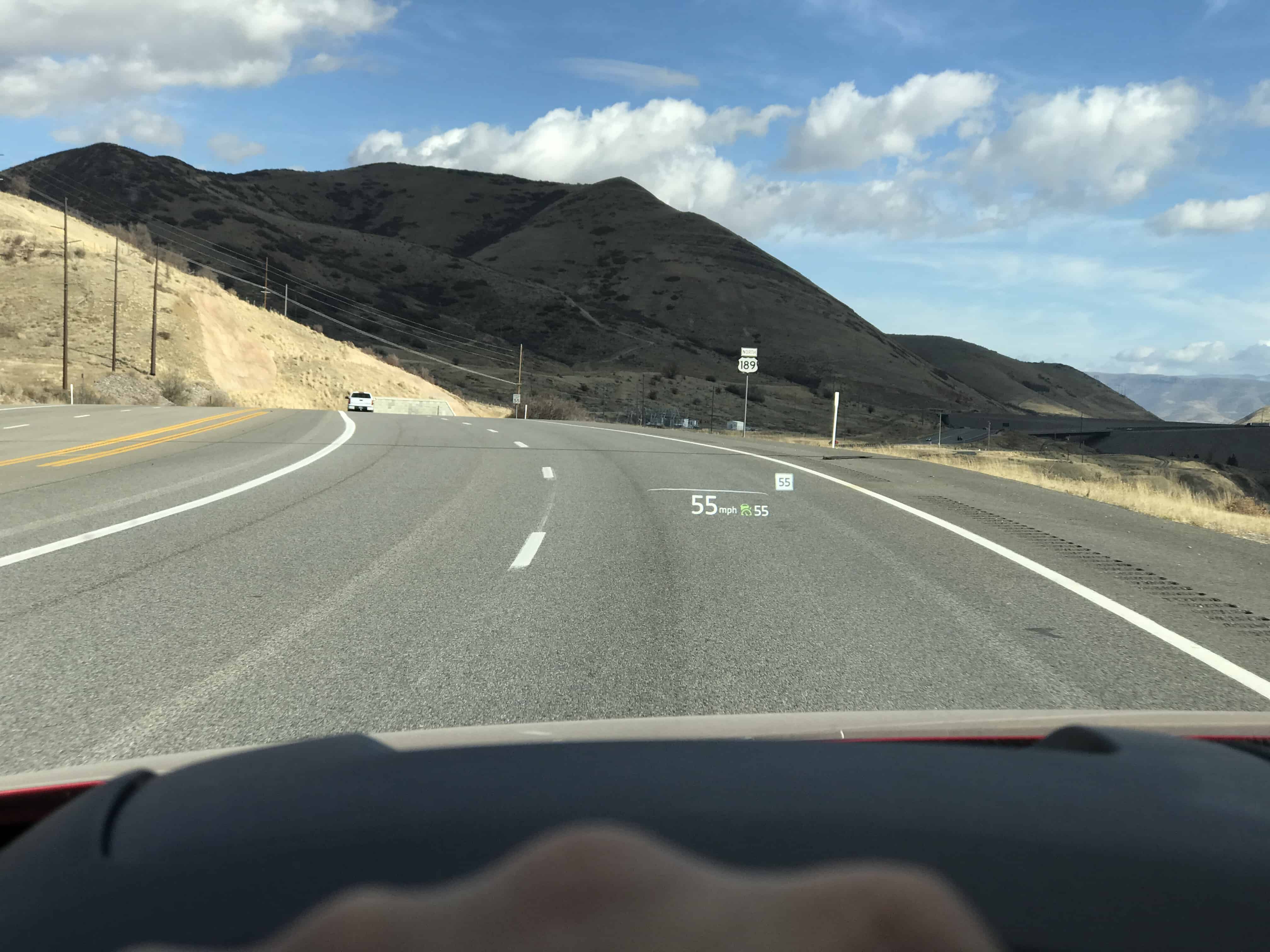 A car parked on the side of a mountain road
