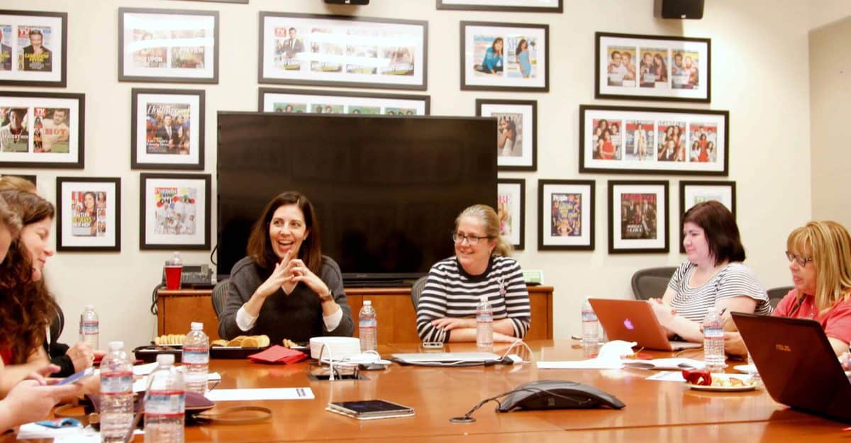 A group of people sitting at a table