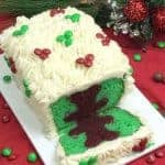 A plate of birthday cake on a table, with Gingerbread and Cream