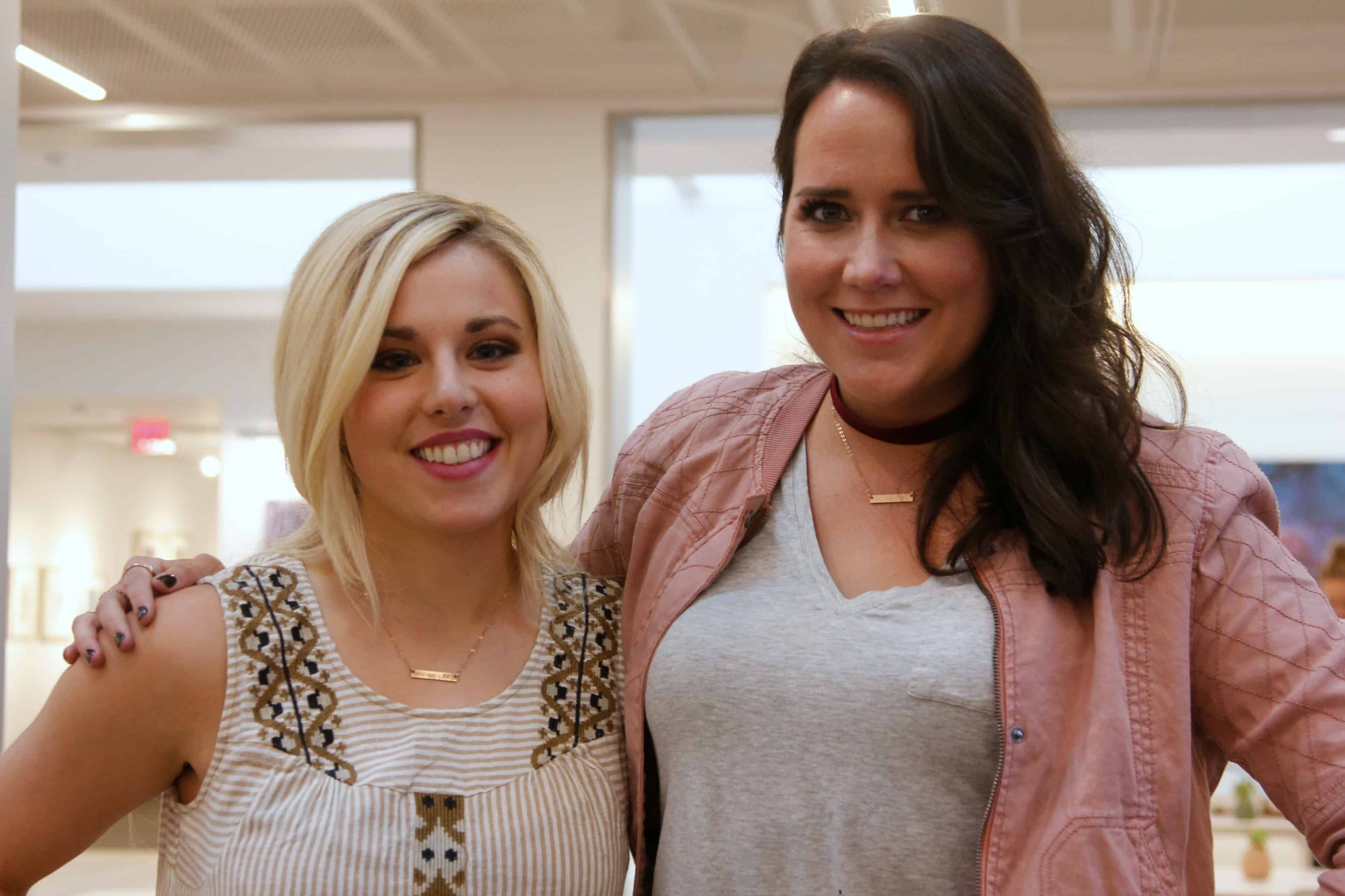 A couple of people posing for the camera