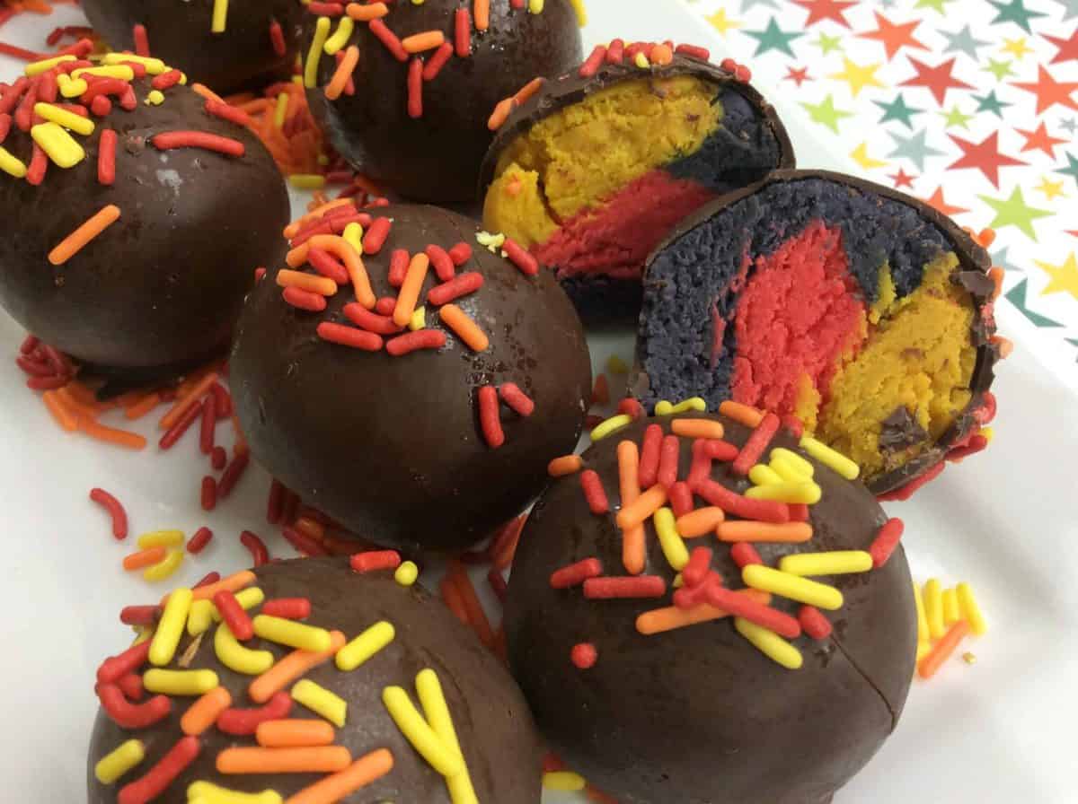 Mardi Gras Cake Balls A close up of many different types of food, with sprinkles