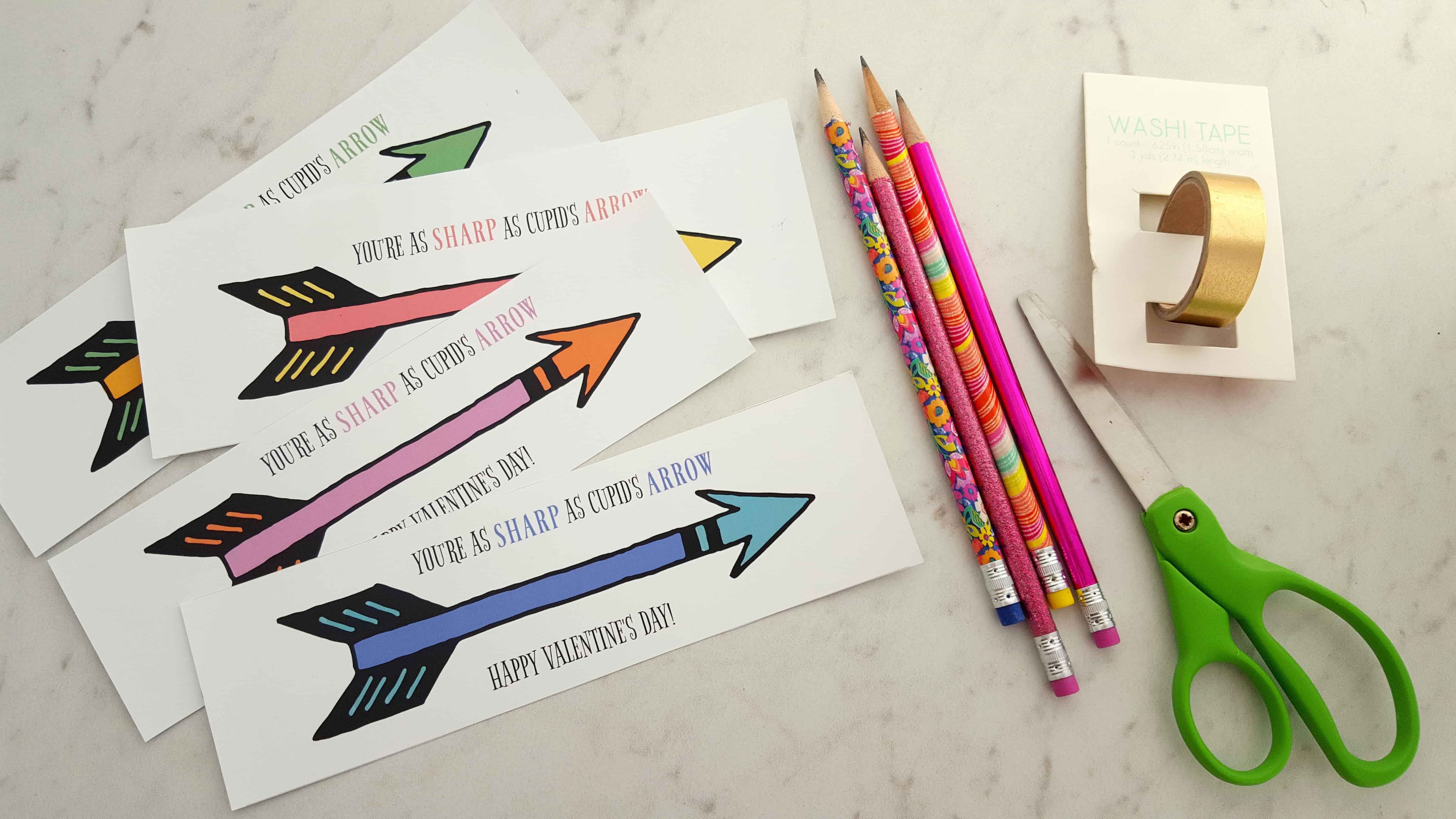 Paper and pencils sitting on a table