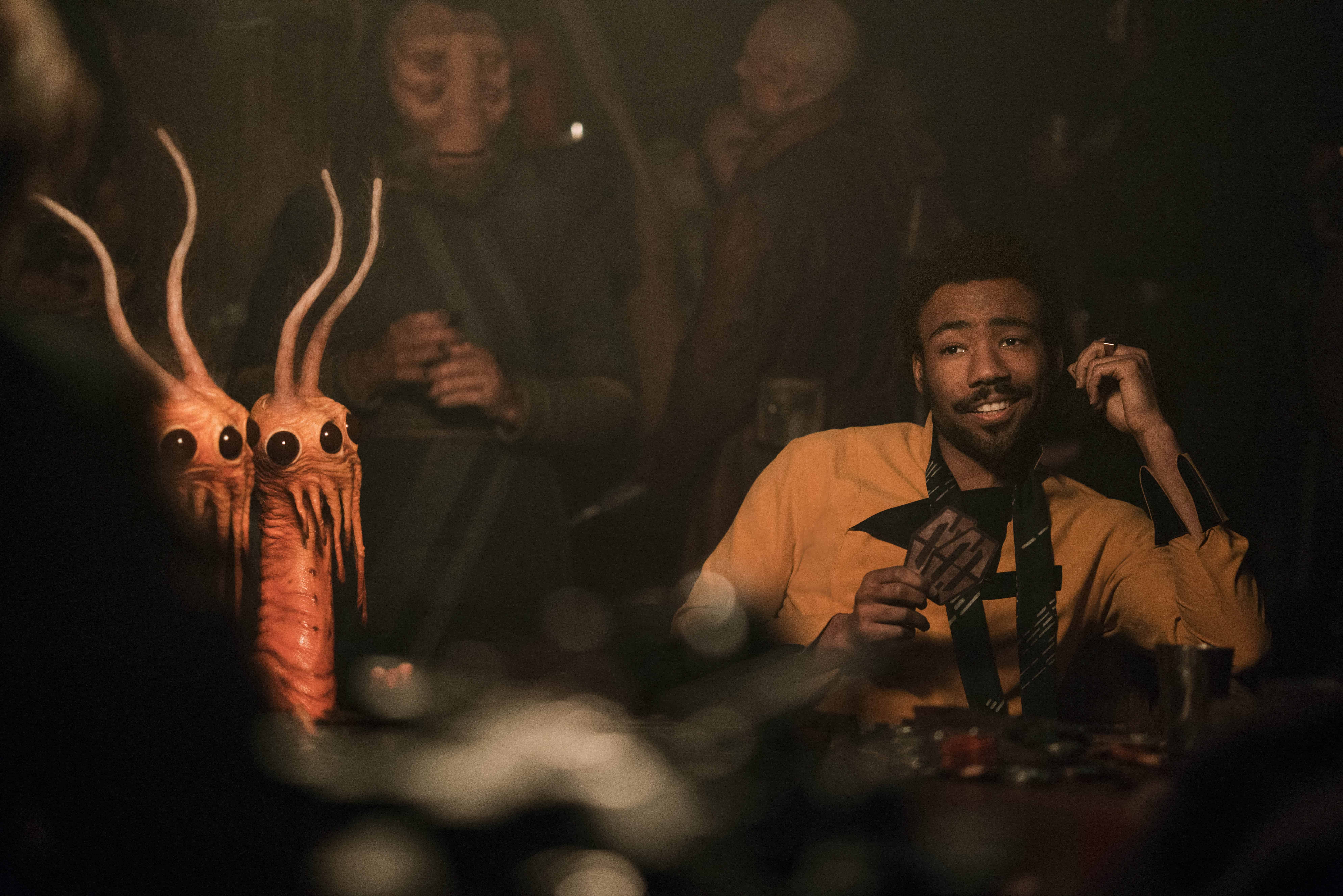 Donald Glover et al. in a dark room