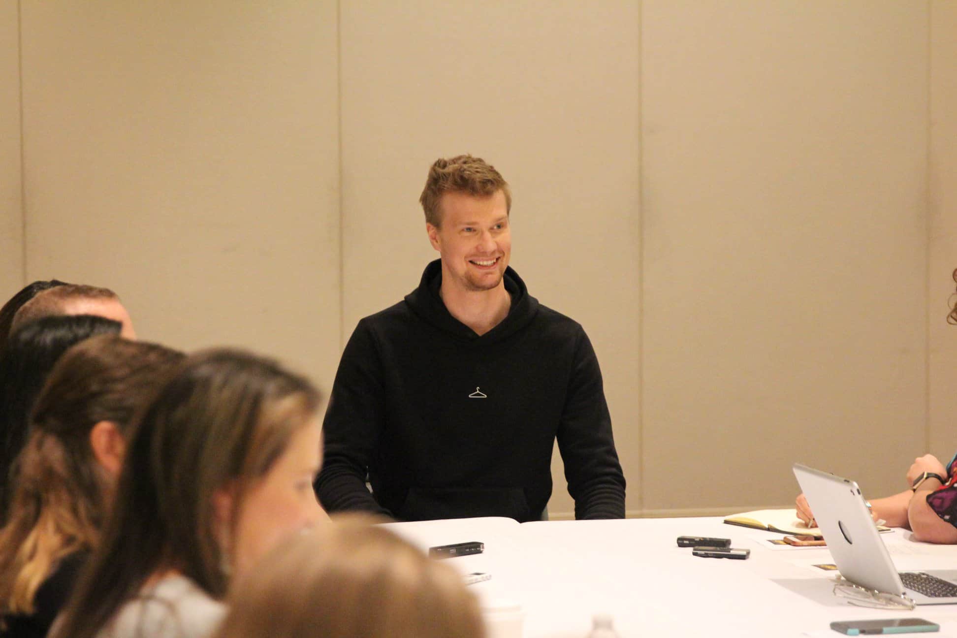 Joonas Suotamo et al. sitting at a table