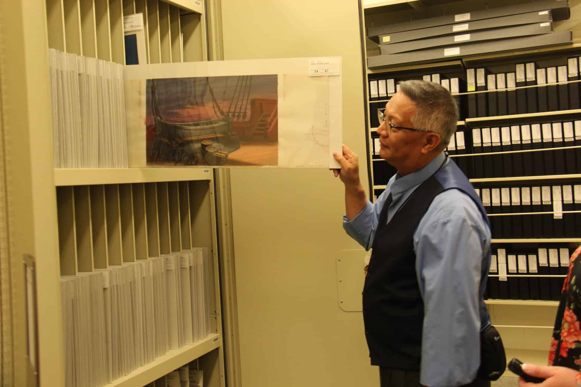 A man standing in a room, with Animation Research Library