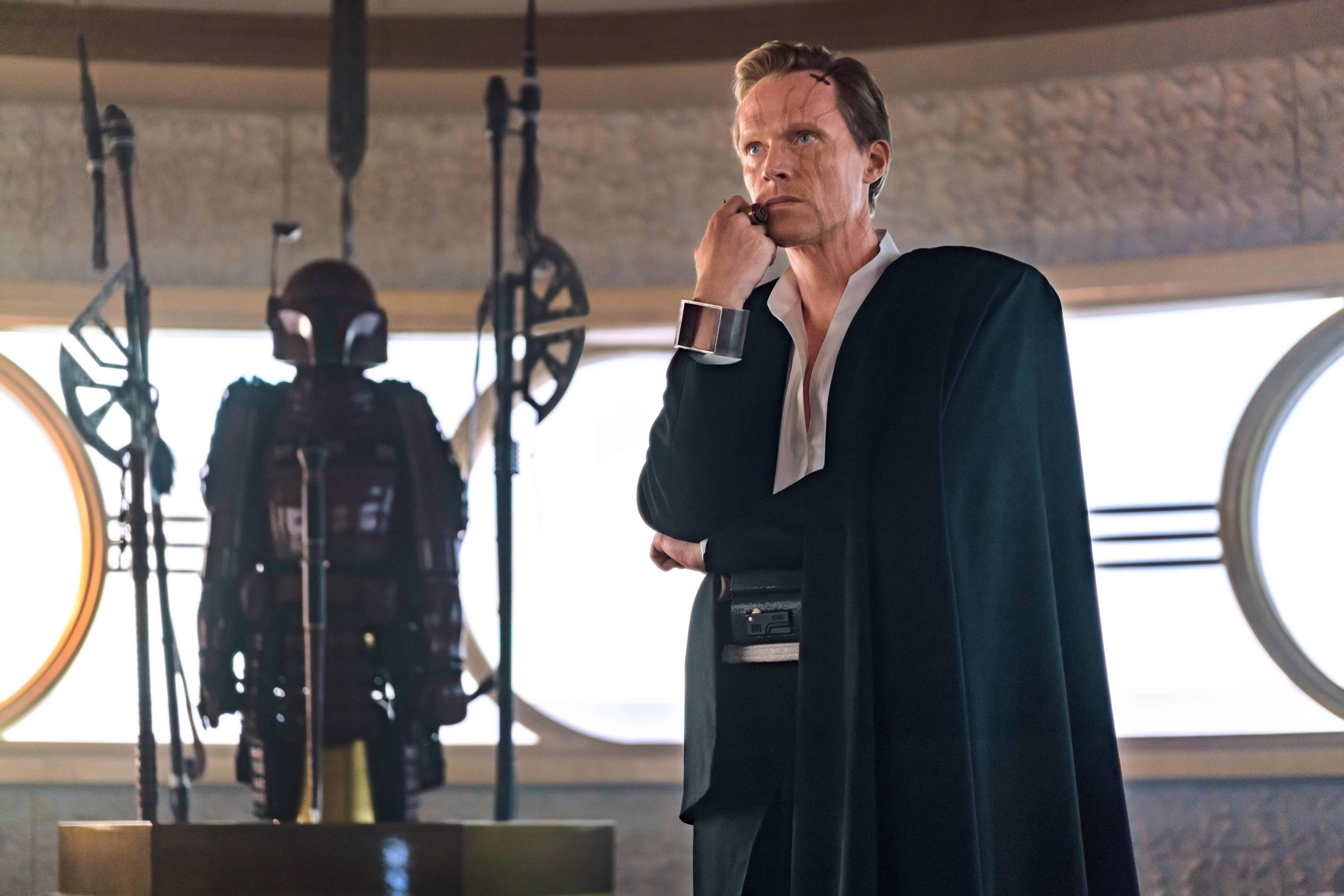 A man standing in front of a mirror posing for the camera, with Star Wars