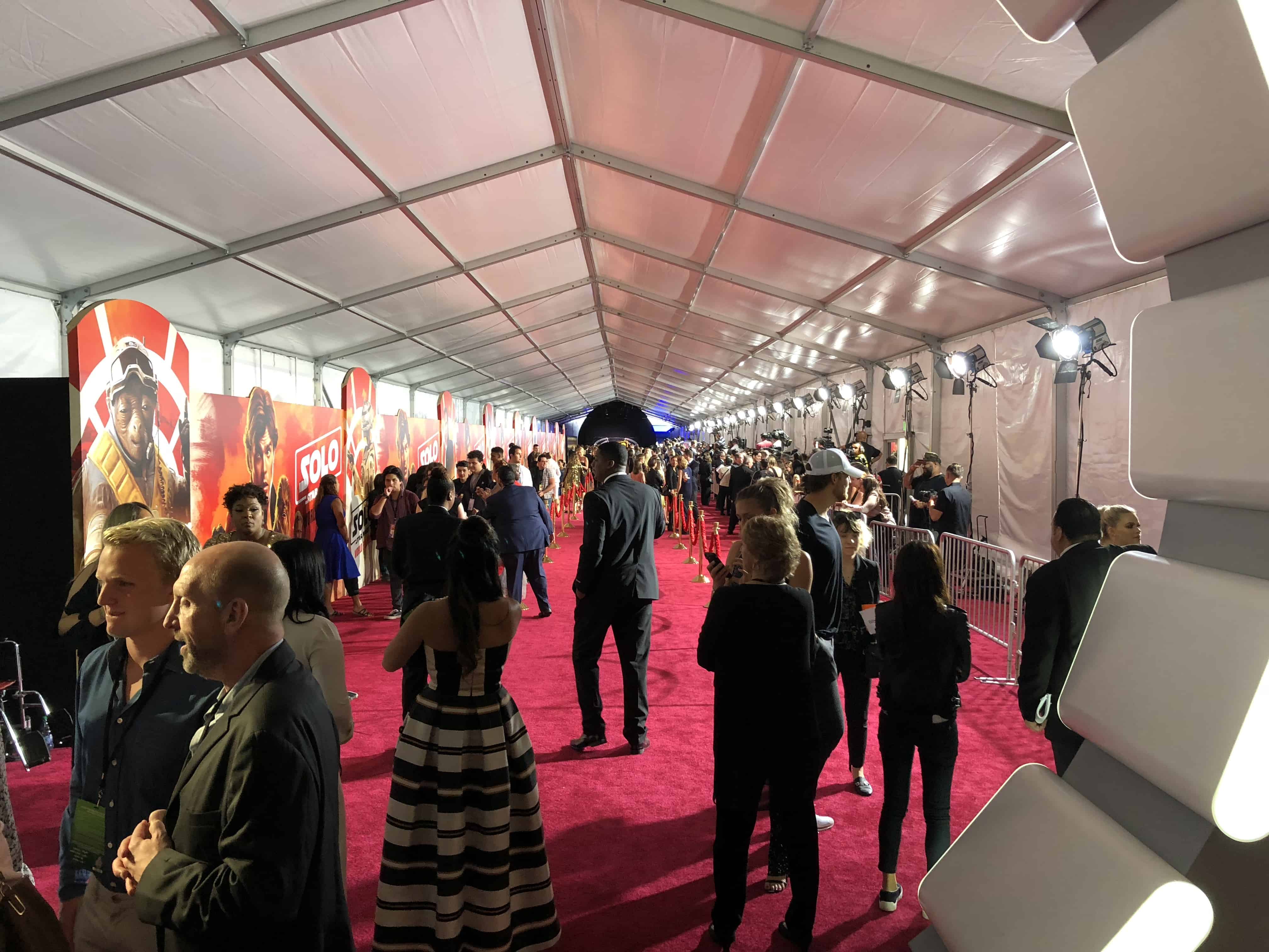 A group of people standing in front of a crowd