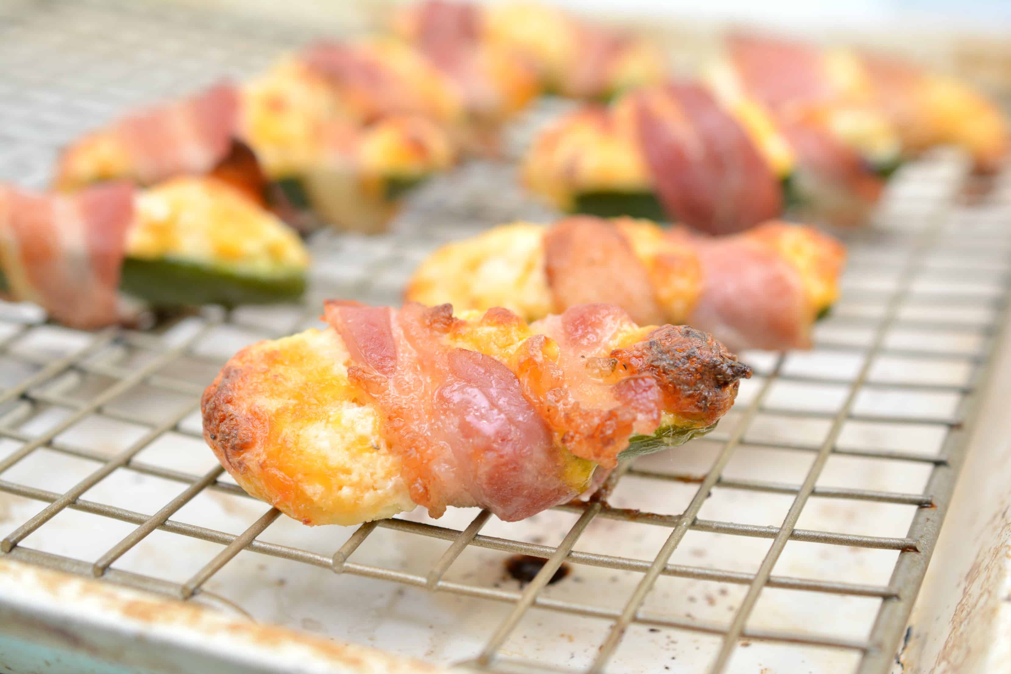 Keto Chicken Stuffed Jalapeno Poppers A jalapeño sitting on top of an oven