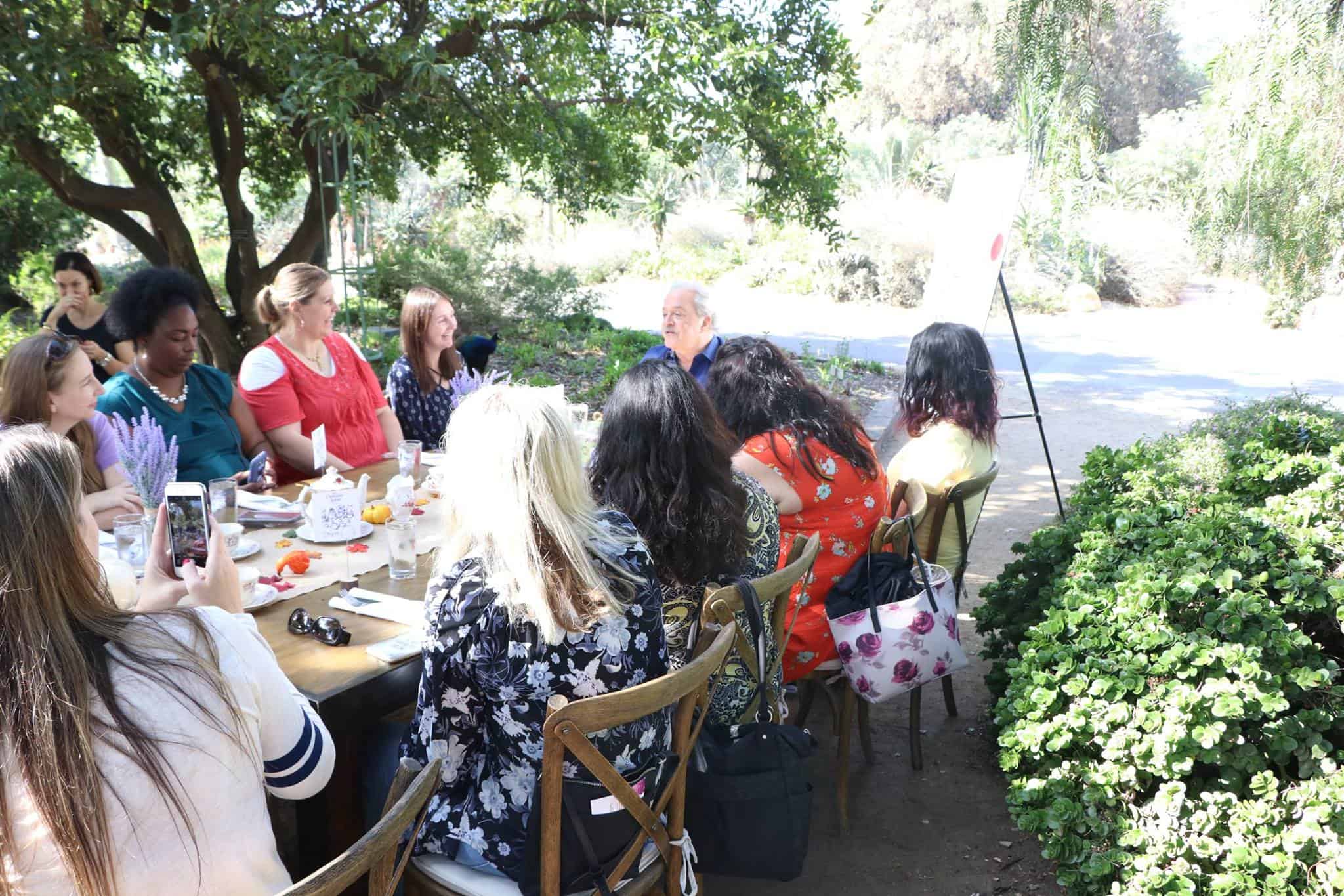 A group of people sitting at a picnic table