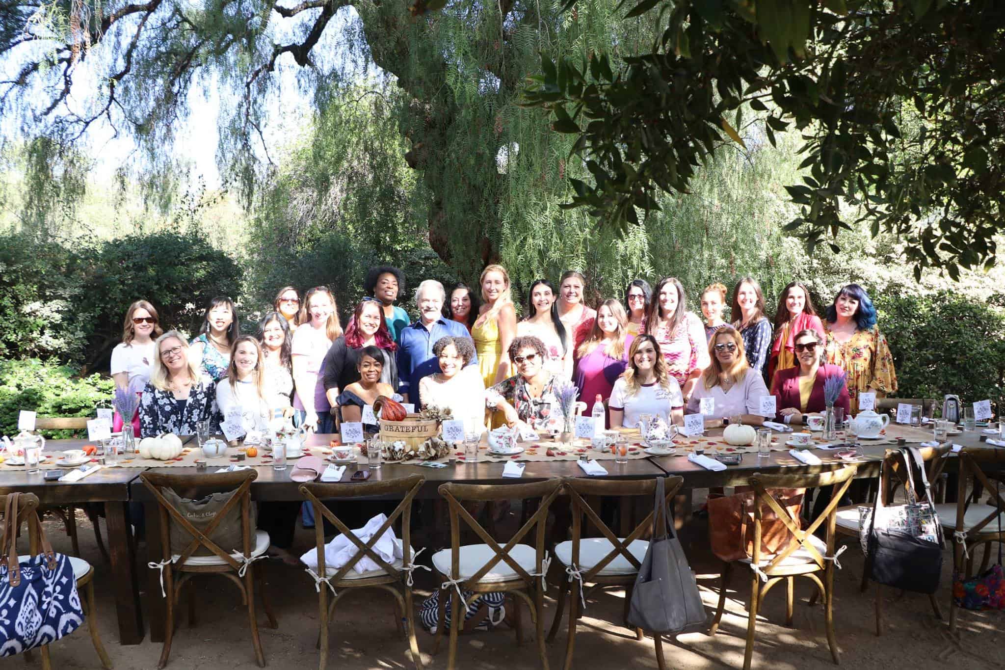 A group of people sitting at a picnic table