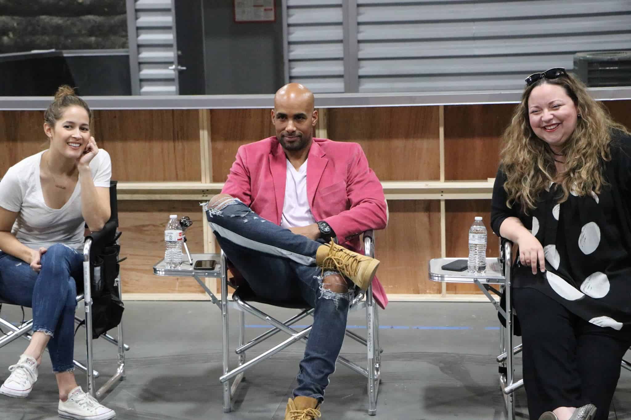 Jaina Lee Ortiz, Boris Kodjoe sitting in chairs