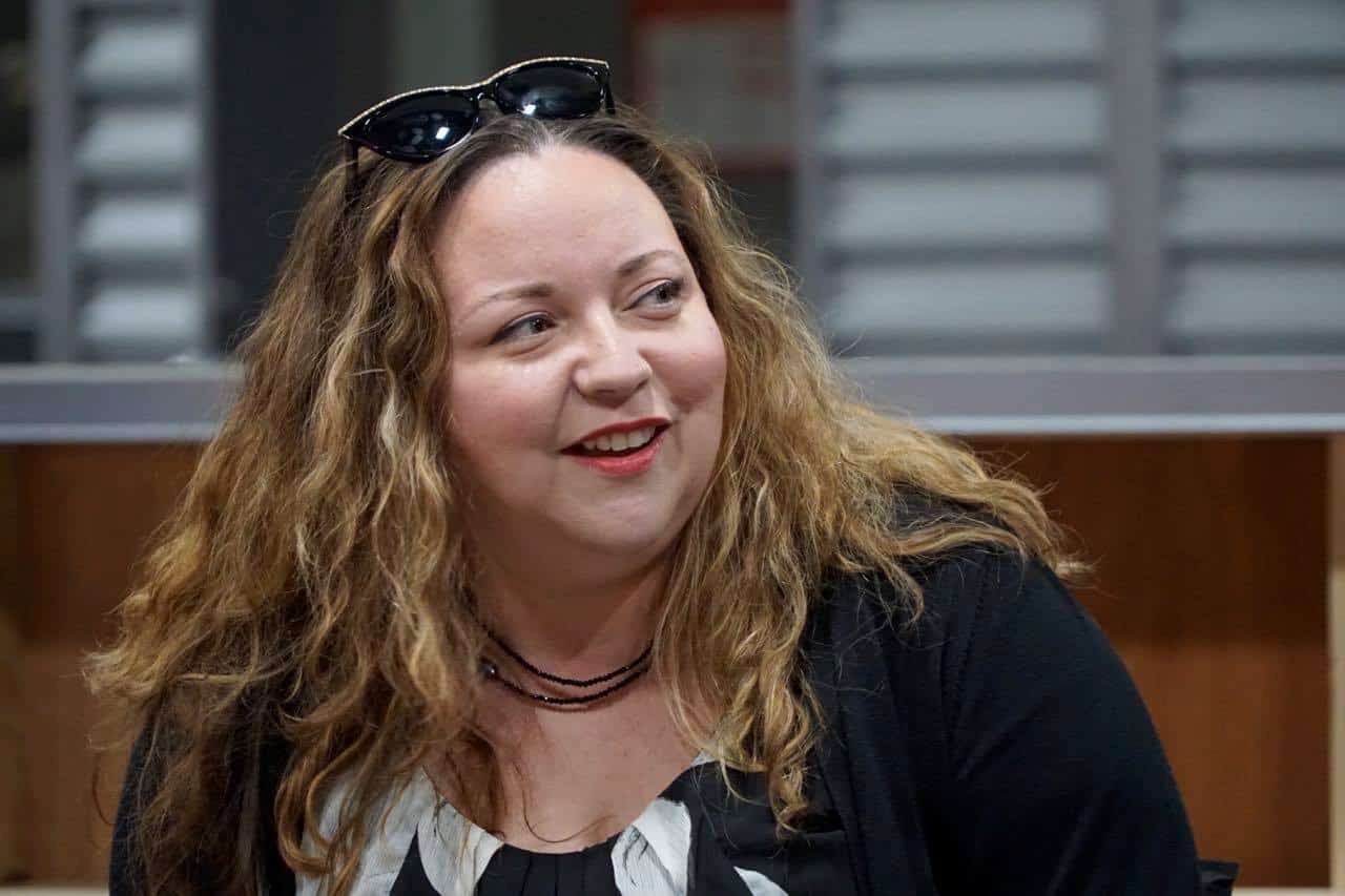 A woman smiling for the camera, with Station 19