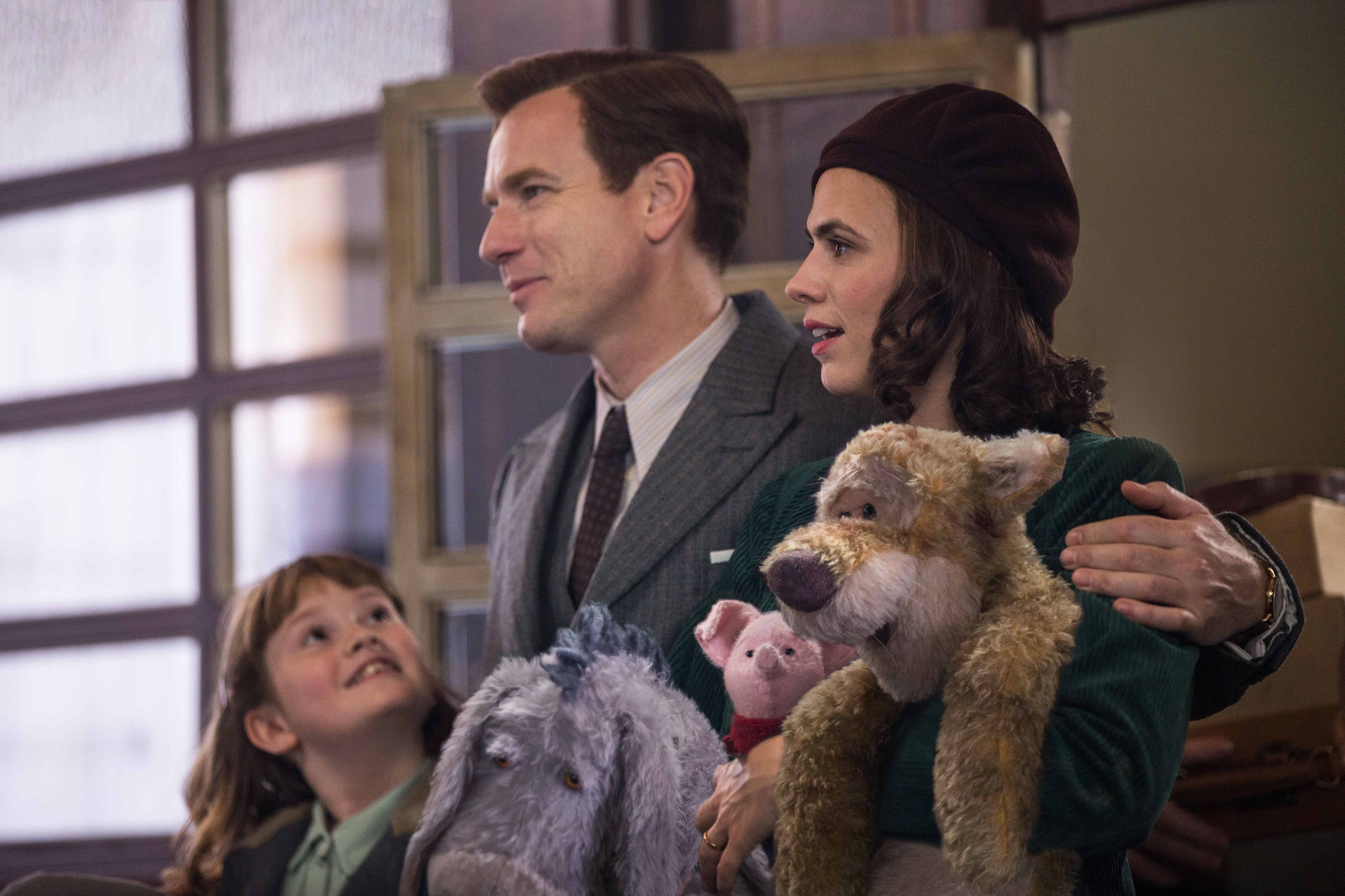 A person holding a teddy bear