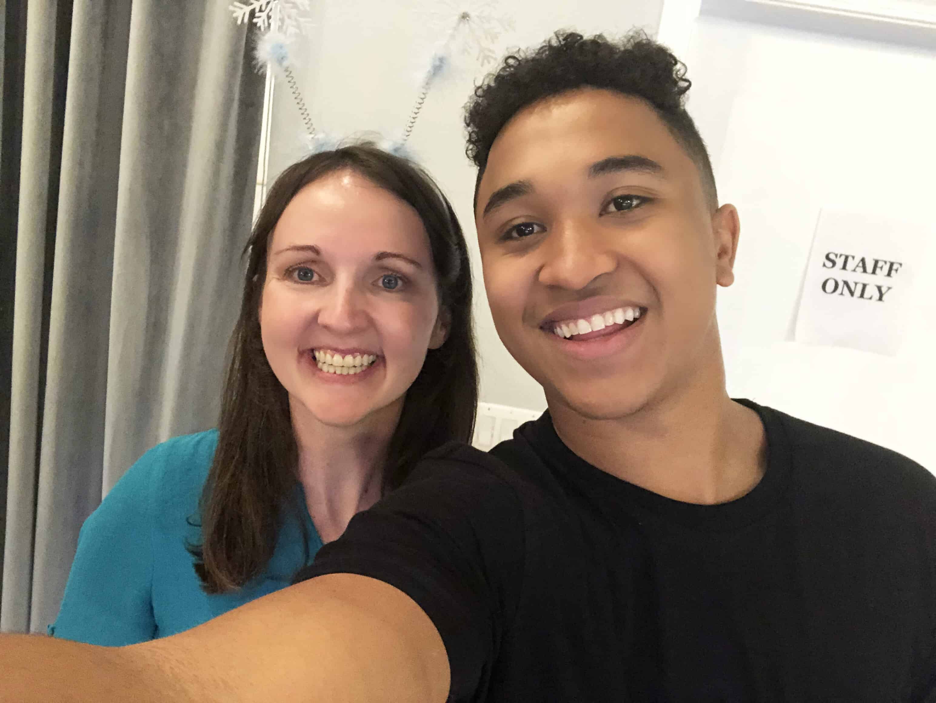 A man and a woman smiling and posing for the camera