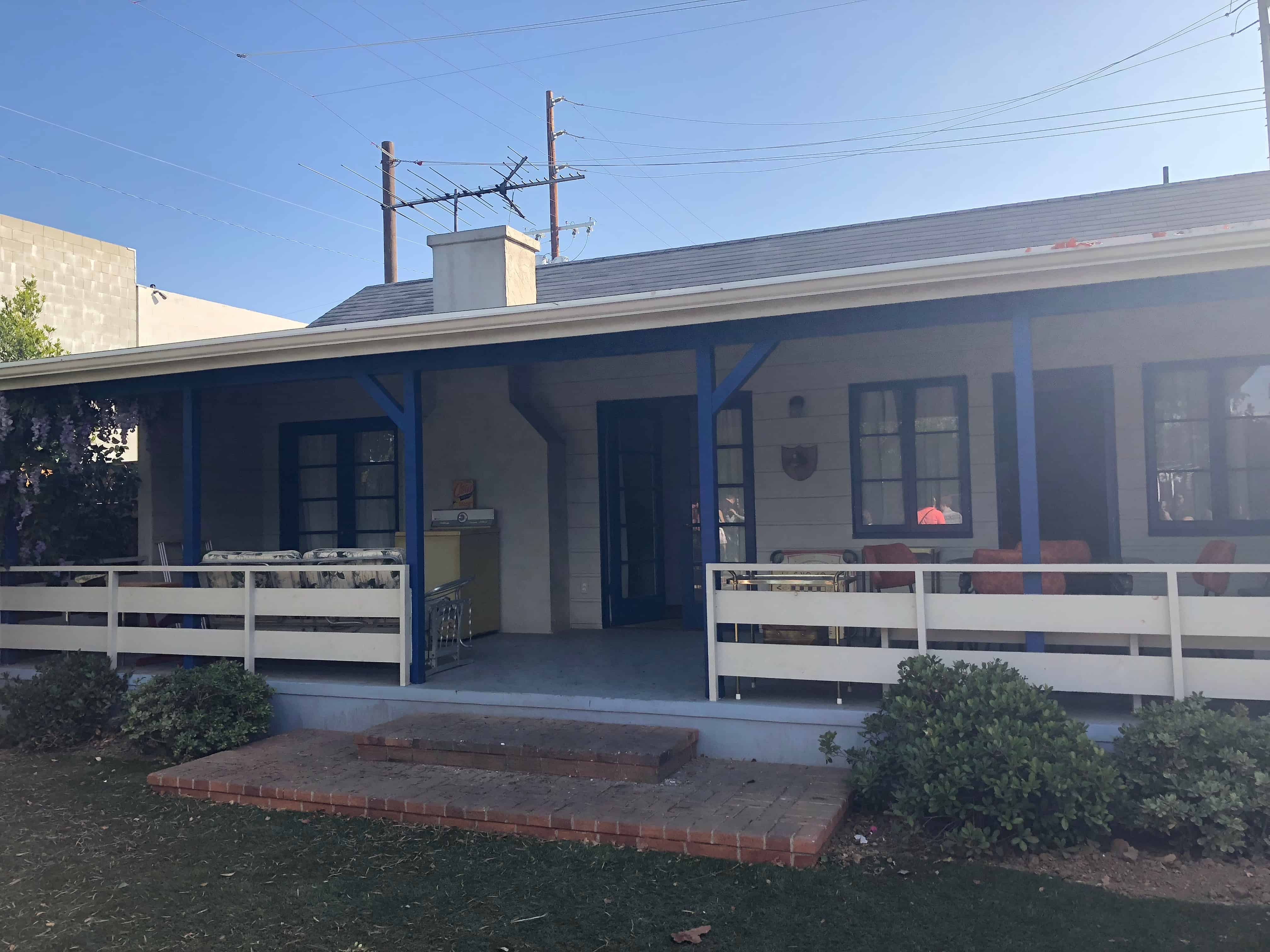 A truck is parked in front of a house