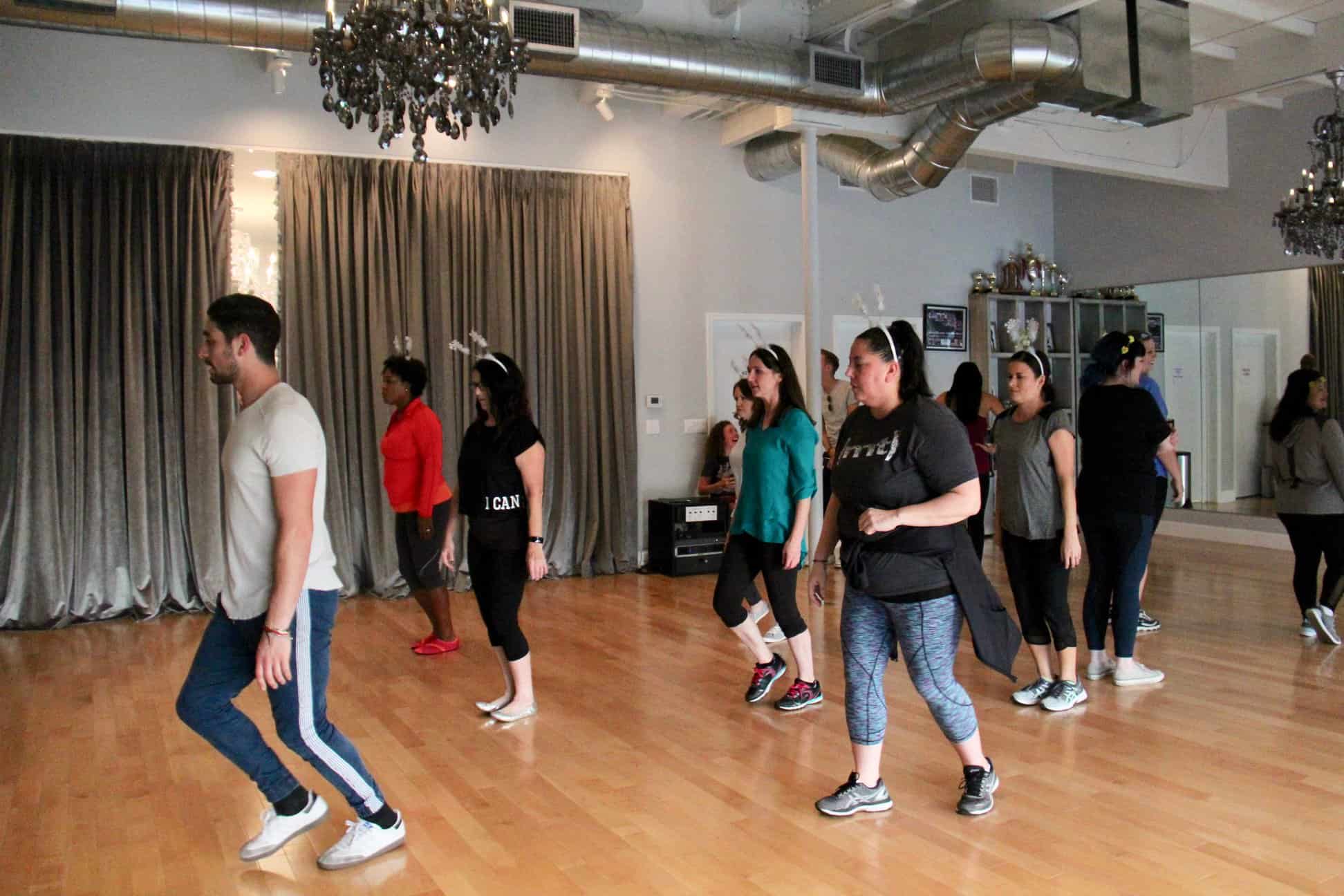 A group of people standing in a room