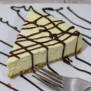 A piece of cake on a plate, with Cheesecake