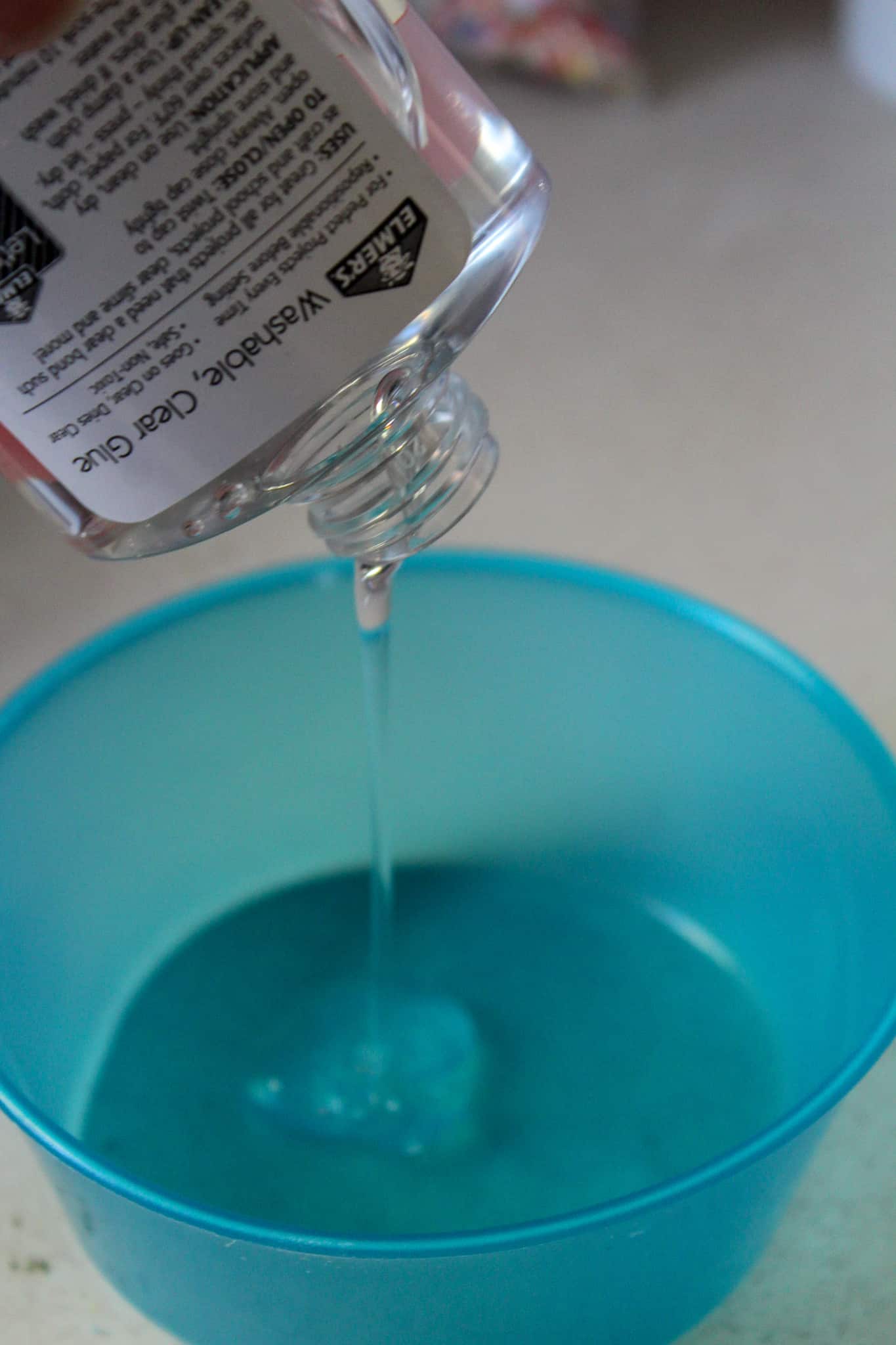 A glass with a blue bowl, with Slime and Foam