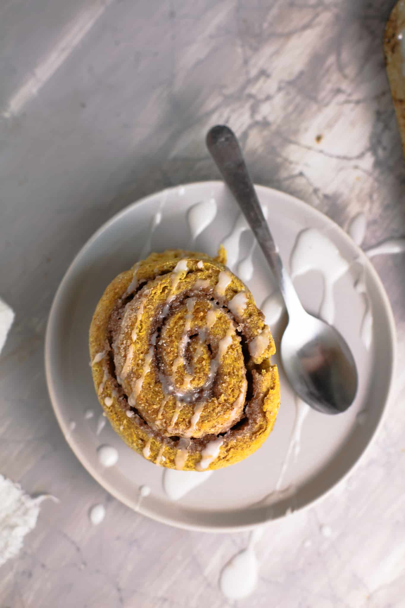 A cinnamon roll on a plate