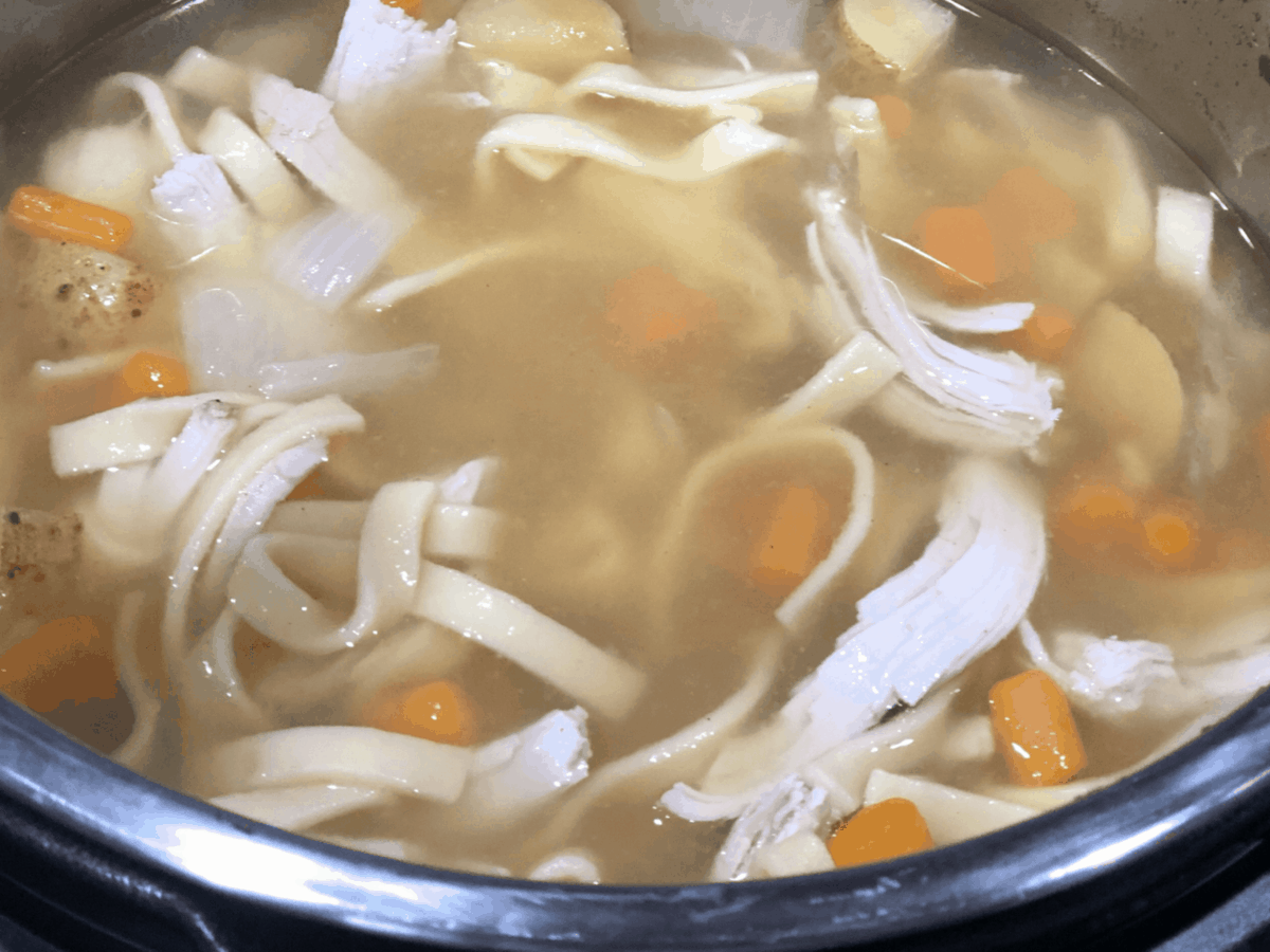 A bowl of soup and a spoon