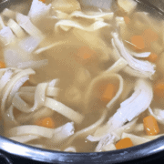 A bowl of soup and a spoon