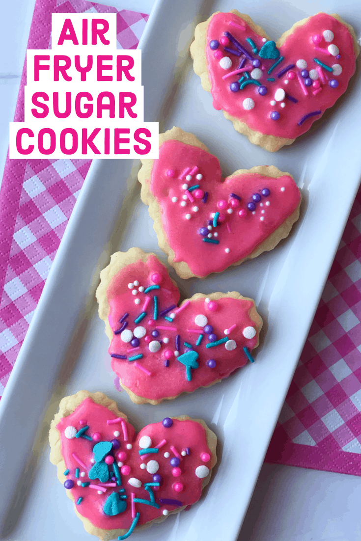 A row of heart cookies on a white plate