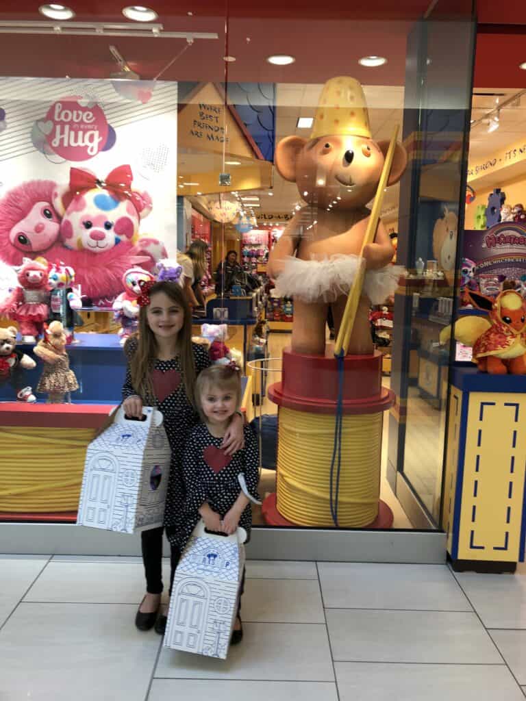 A group of stuffed animals on display in a store