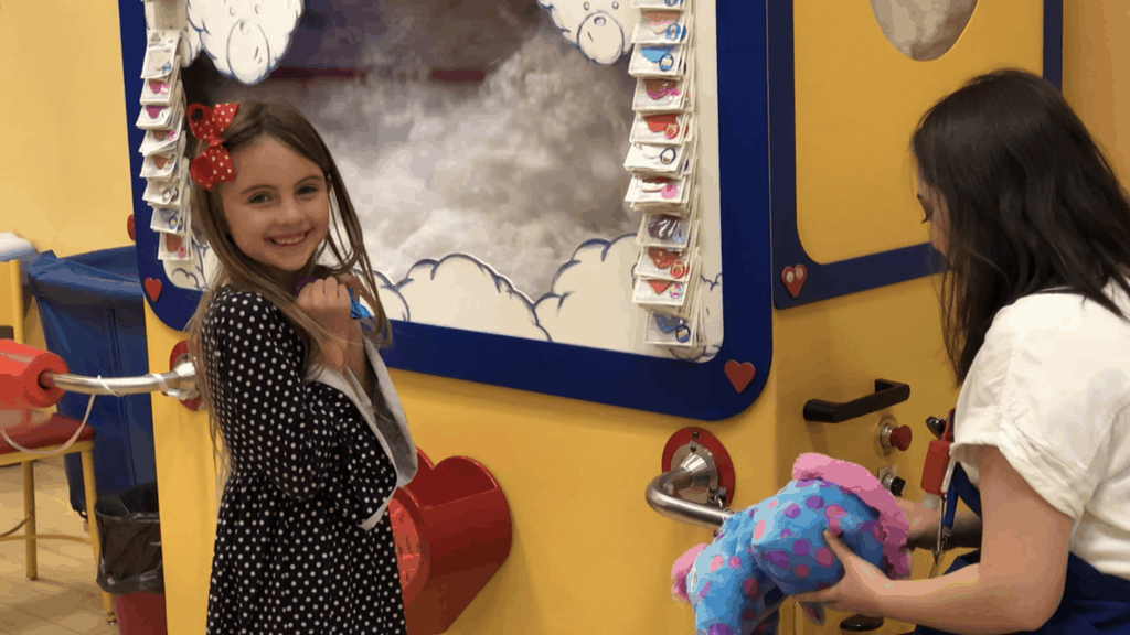 Two kids holding toys
