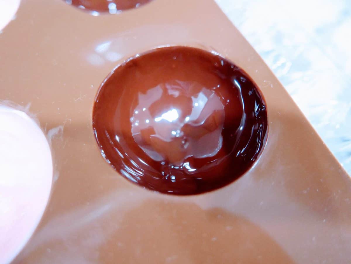 Close-up of a chocolate bubble on a chocolate bar.
