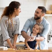 A joyful family baking together in the kitchen, exploring gift ideas for the baker.