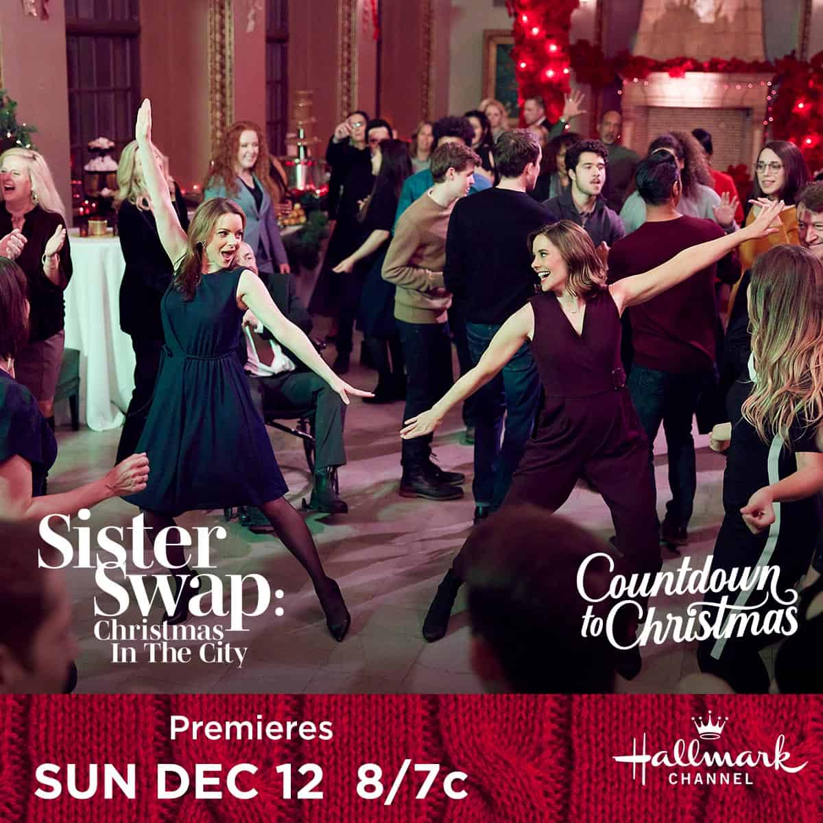 Two sisters dancing joyfully at a festive Sister Swap Christmas in the City party.