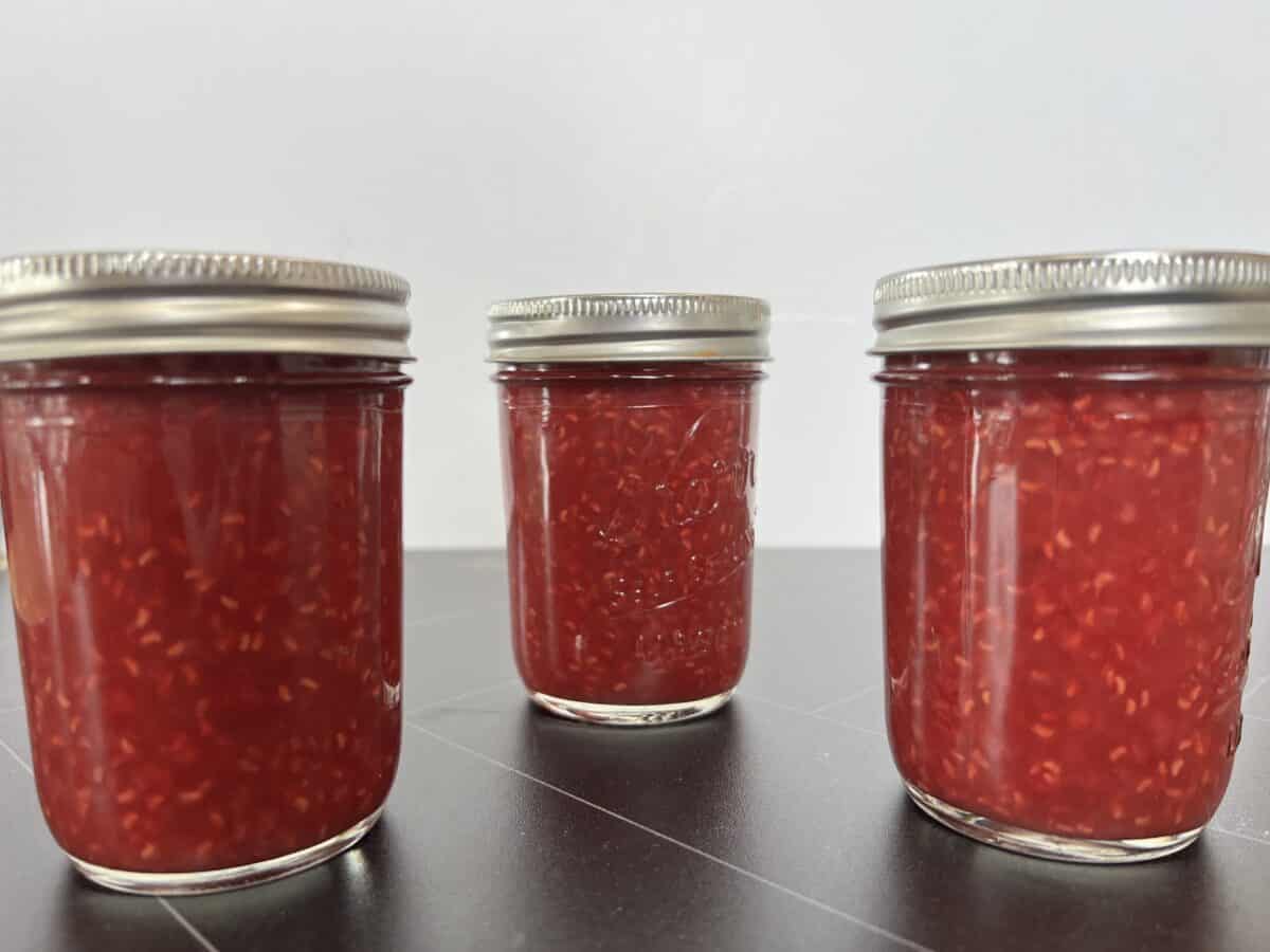 three jars of jam on counter